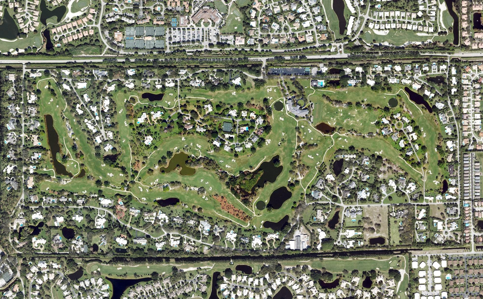 Aerial view of The Country Club of Florida, FL, with its hole routing marked