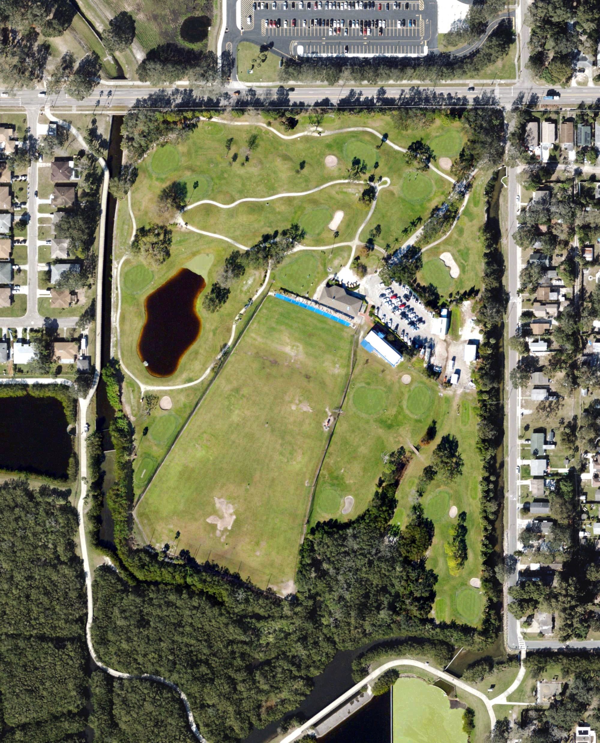 Aerial view of Twin Brooks Golf Course and Driving Range, FL, with its hole routing marked