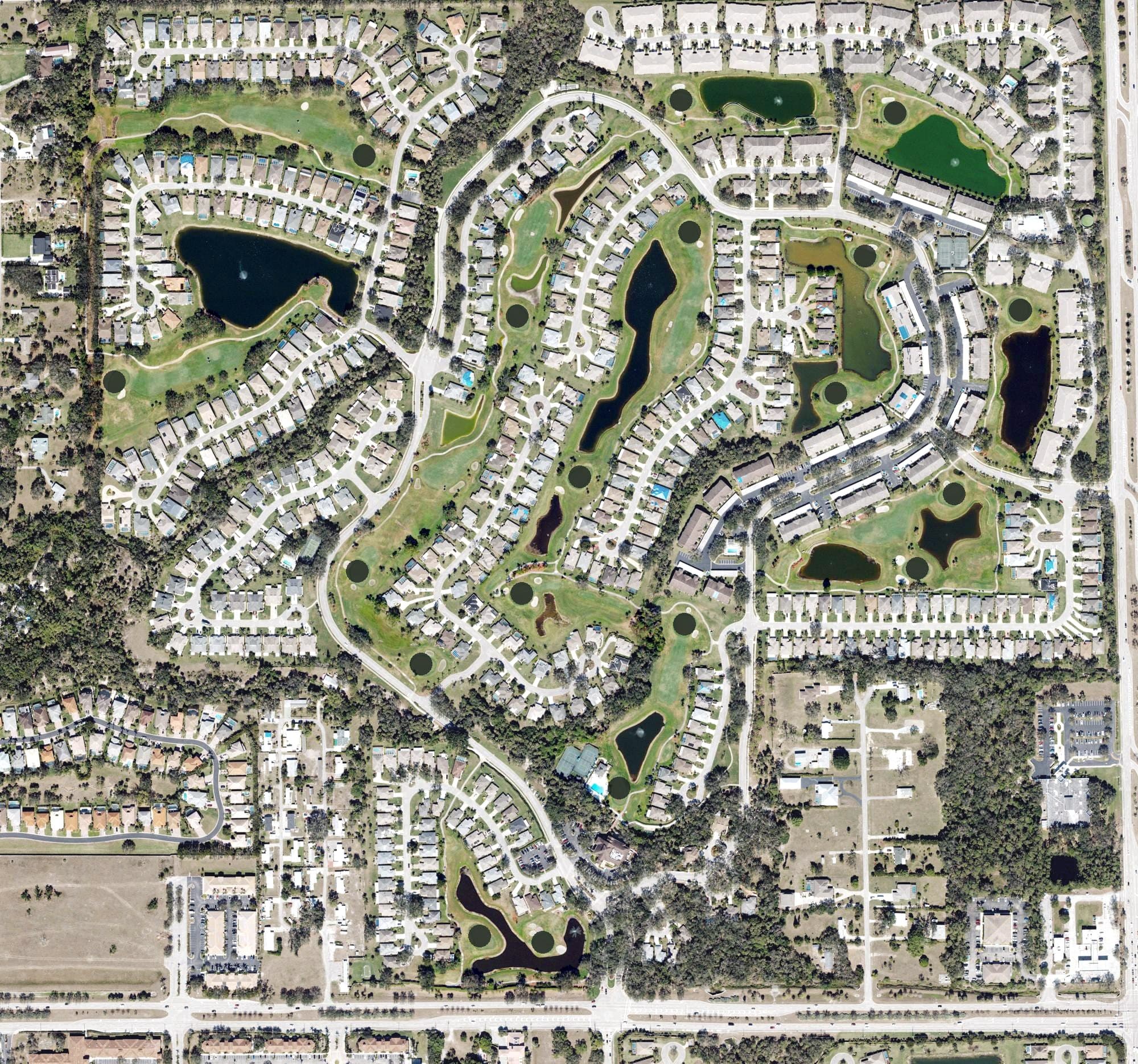 Aerial view of Villages at Country Creek, FL, with its hole routing marked