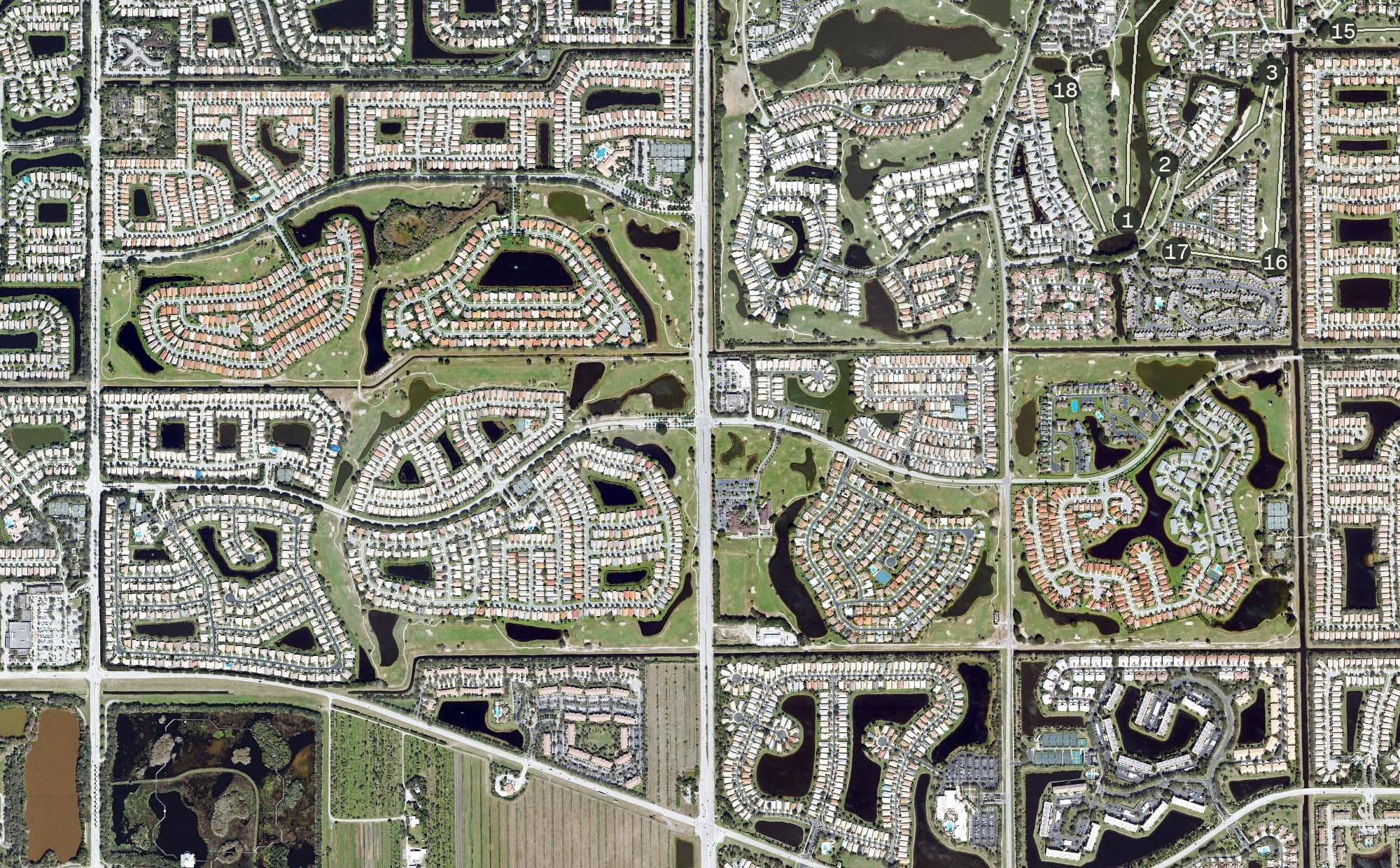 Aerial view of Westchester Golf & Country Club, FL, with its hole routing marked