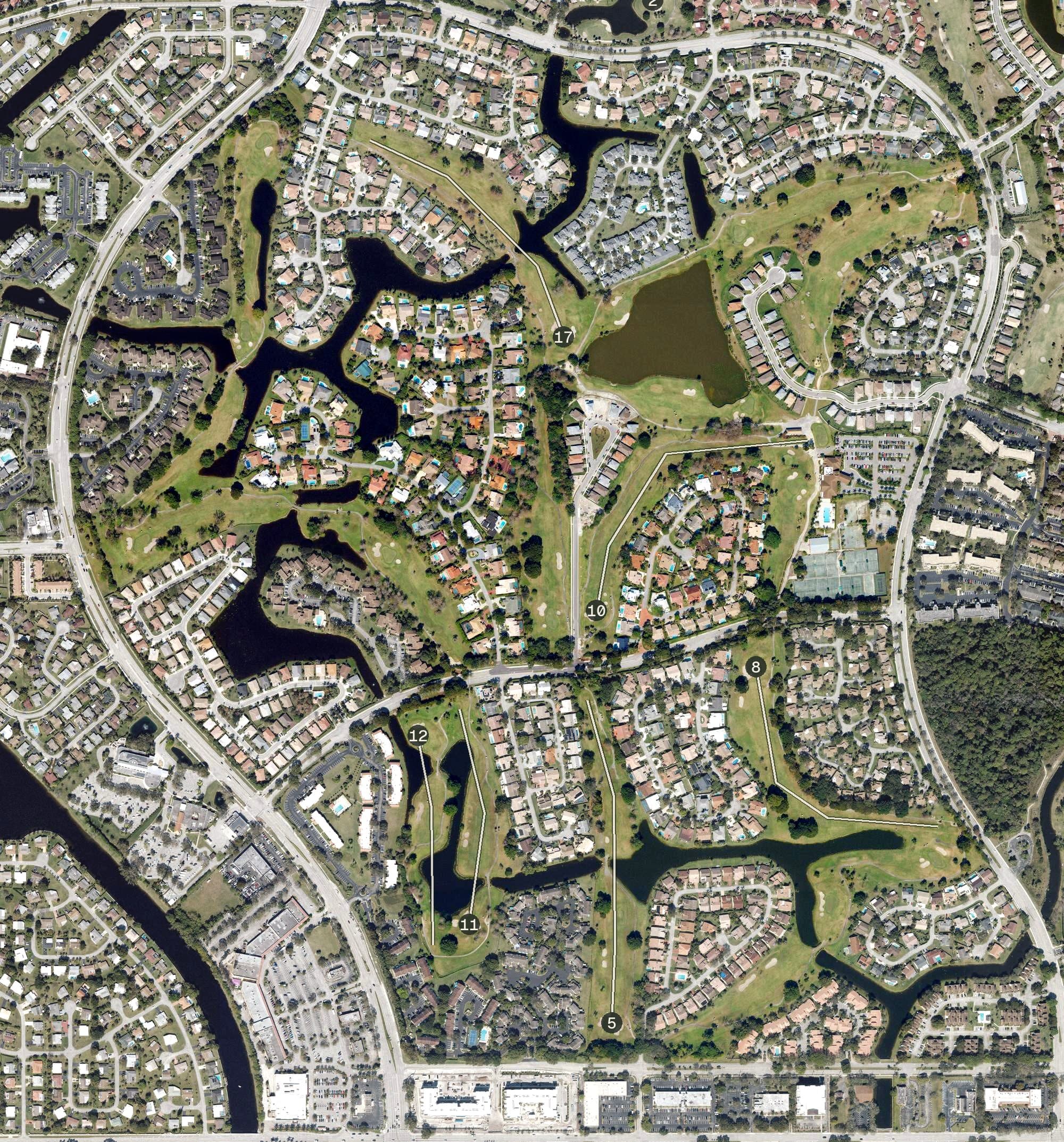 Aerial view of Woodmont Country Club, FL, with its hole routing marked