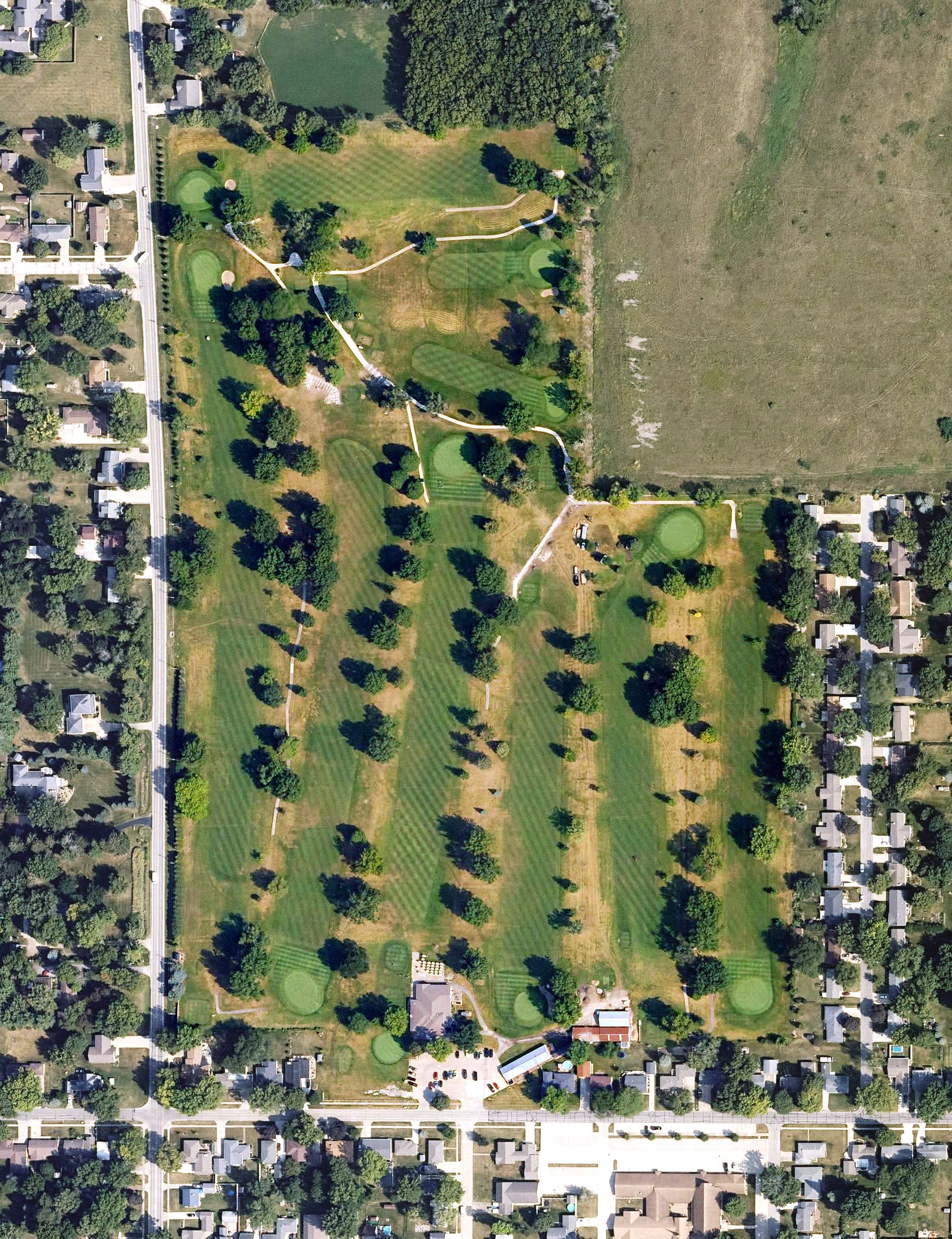 Aerial view of Pella Golf & Country Club, IA, with its hole routing marked