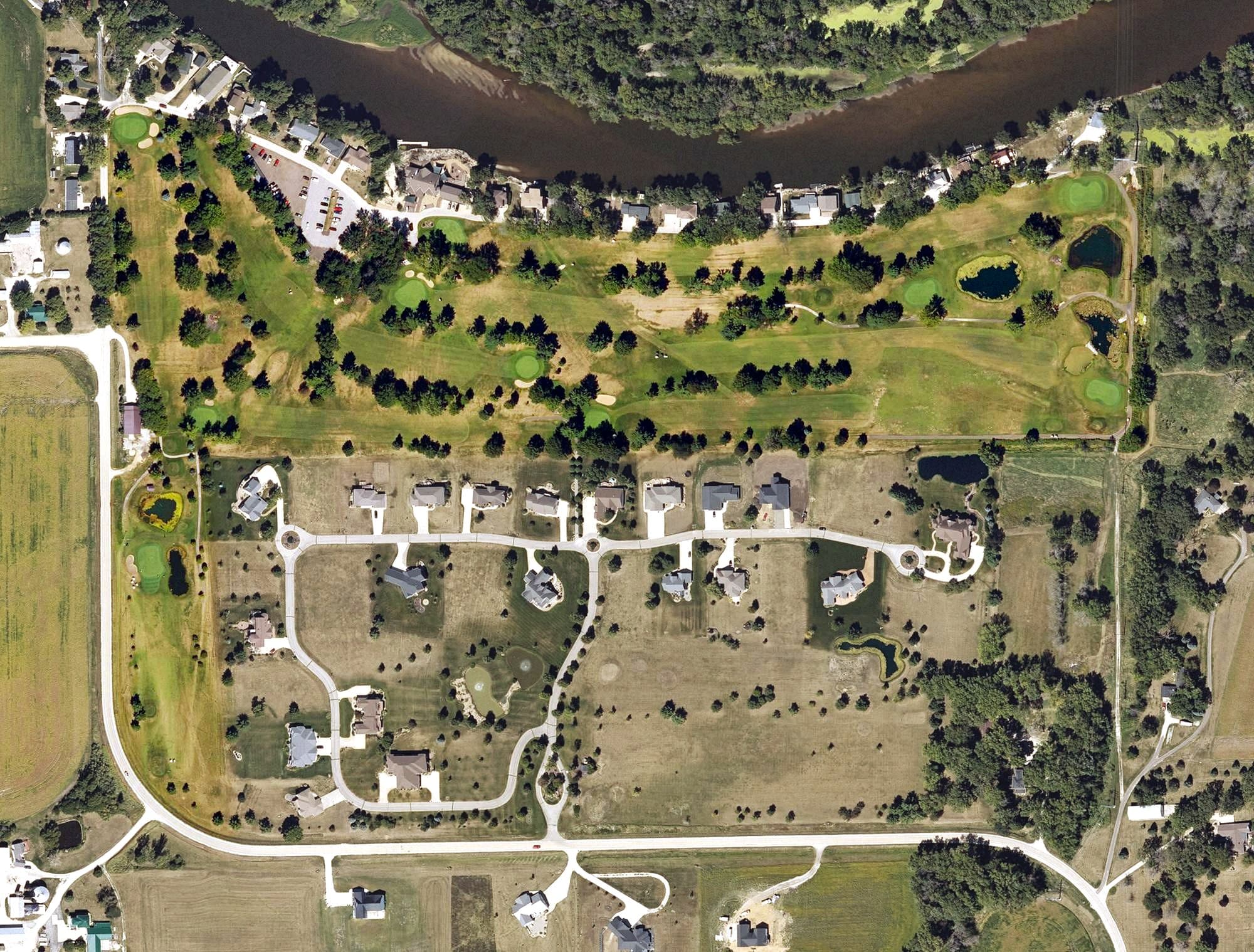 Aerial view of River Ridge Golf Club, IA, with its hole routing marked