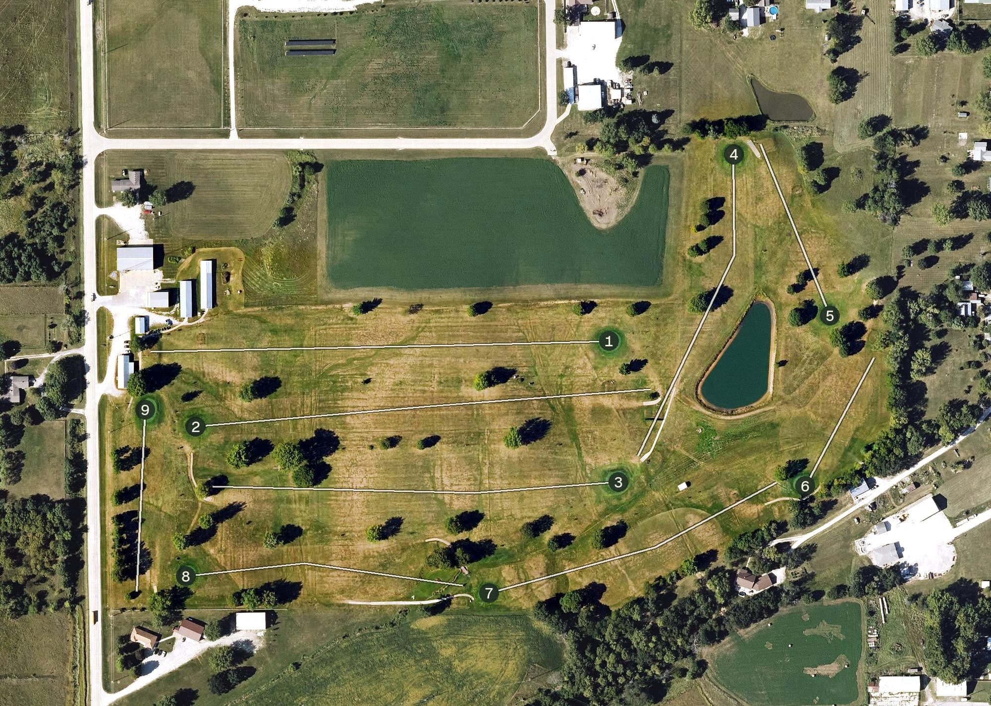Aerial view of Sigourney Golf Club, IA, with its hole routing marked
