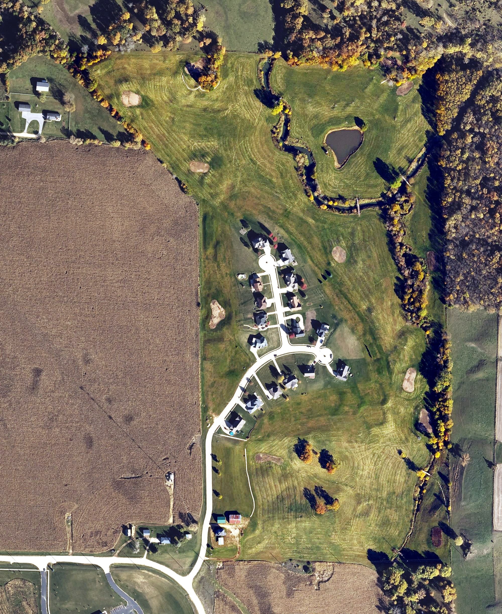 Aerial view of Timber City Golf Course, IA, with its hole routing marked