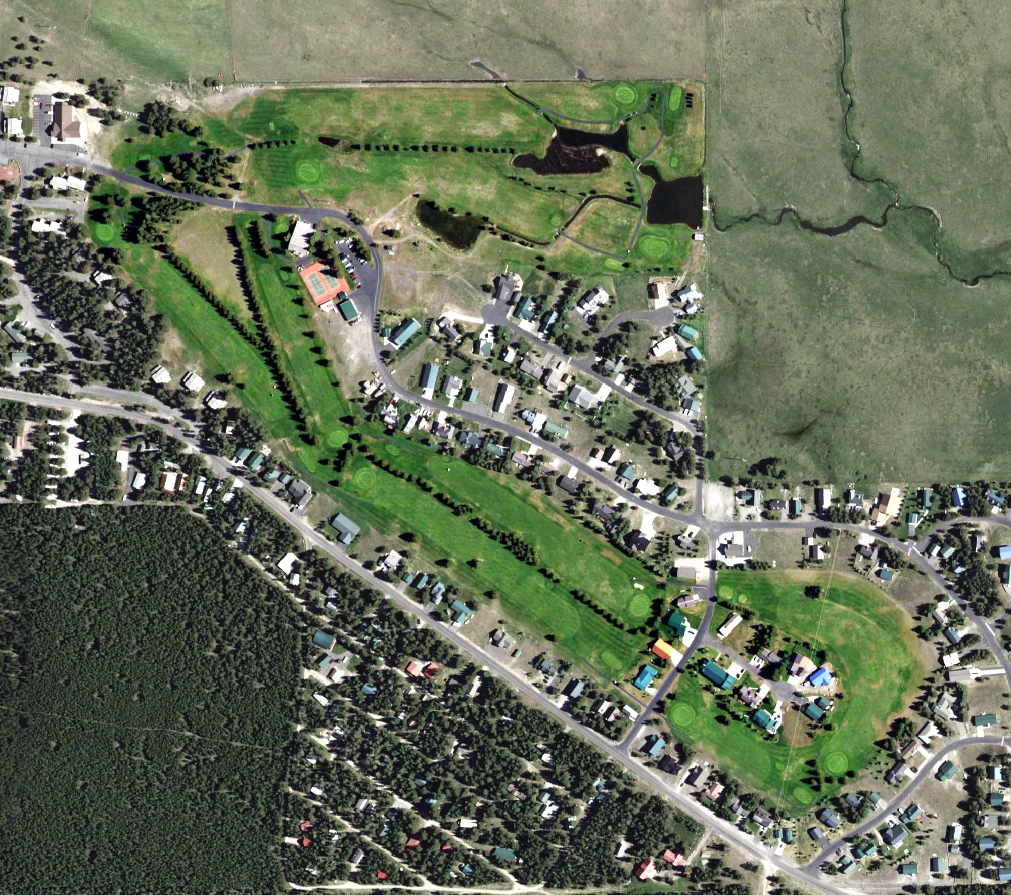 Aerial view of Island Park Golf Course, ID, with its hole routing marked
