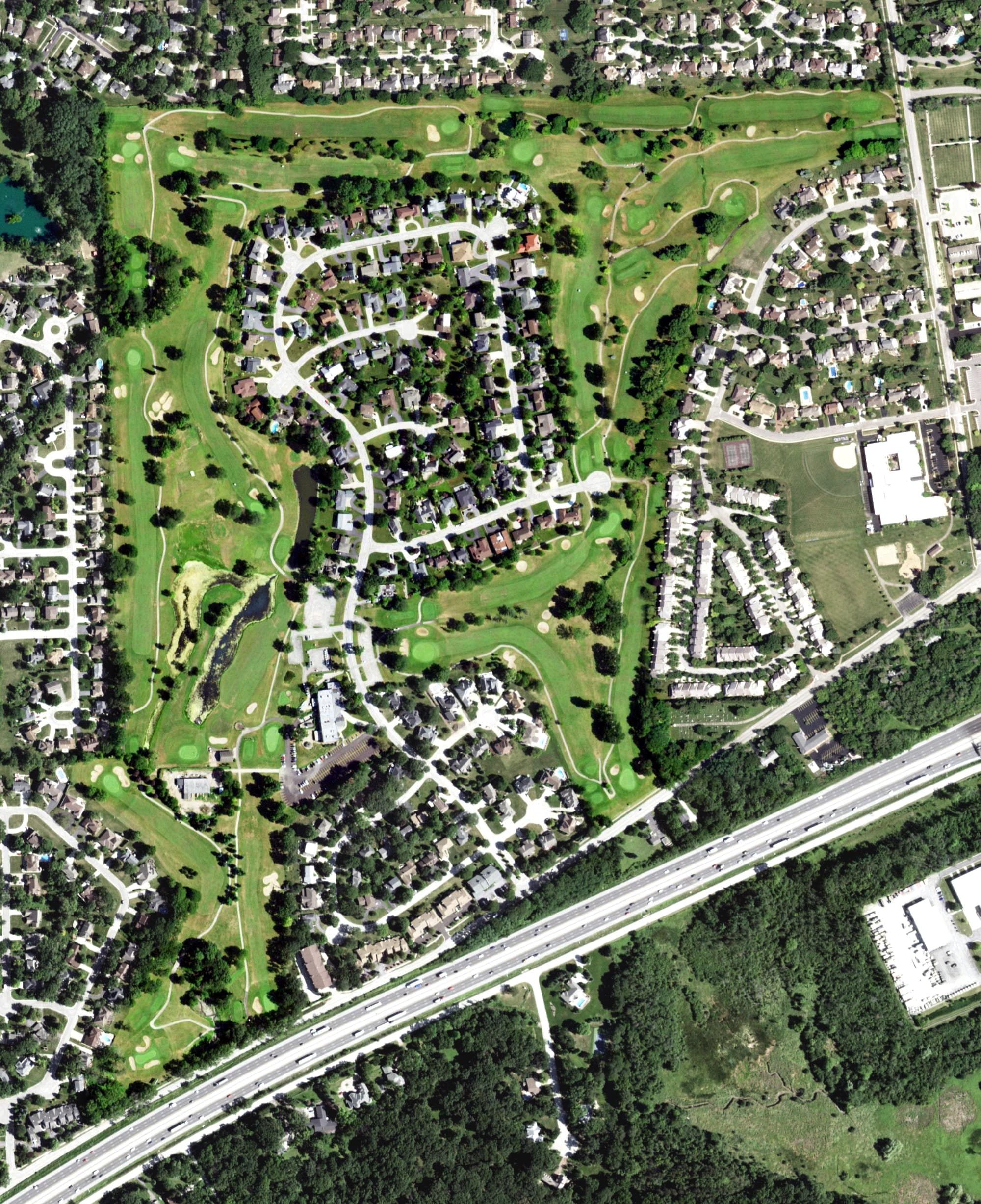 Aerial view of Carriage Greens Golf Club, IL, with its hole routing marked
