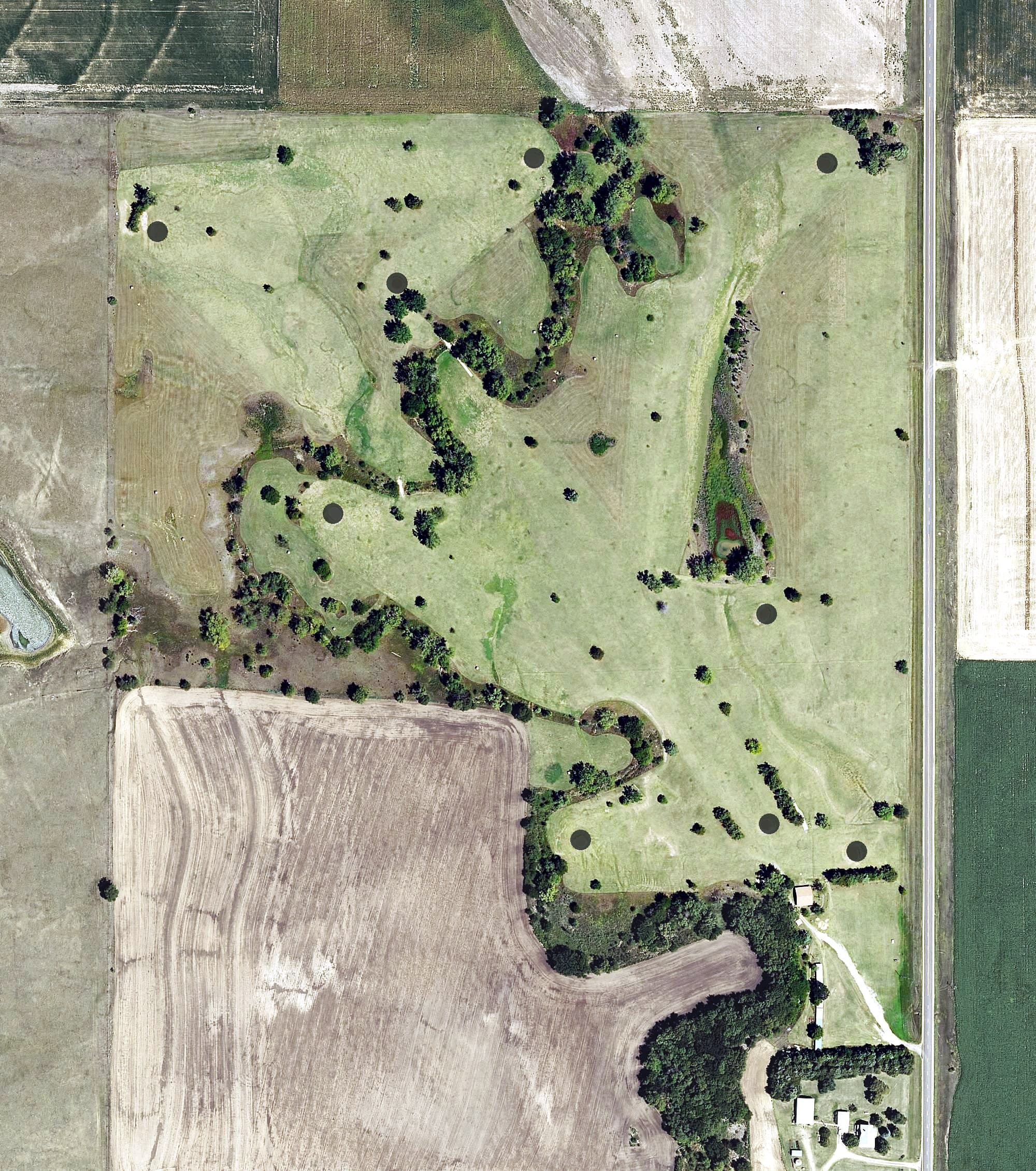 Aerial view of Downs Golf Club, KS, with its hole routing marked