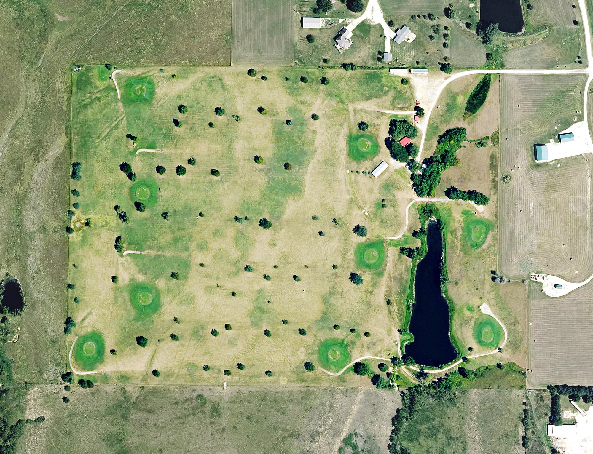 Aerial view of Madison Golf Course, KS, with its hole routing marked