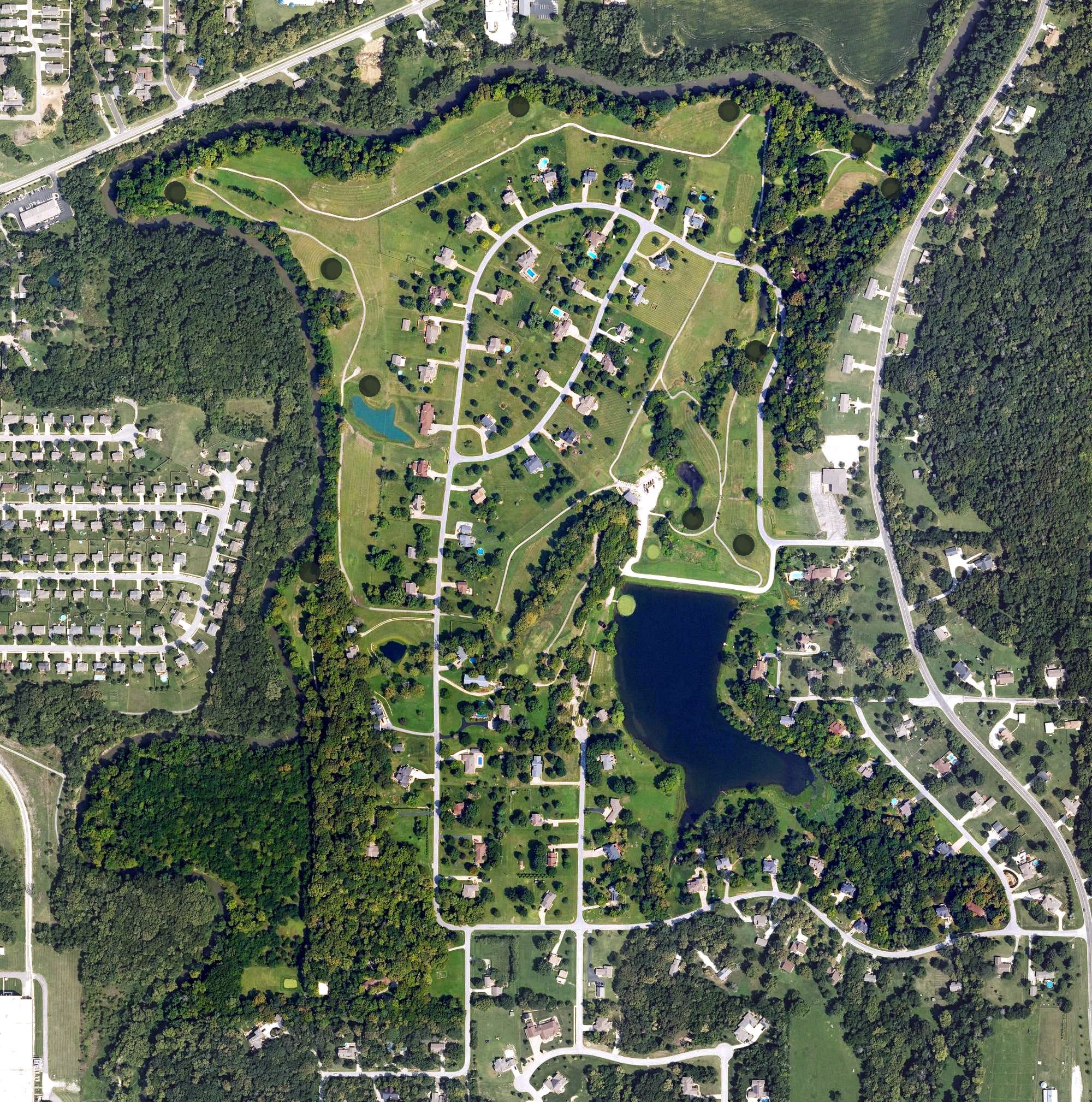 Aerial view of Oak Country Golf Club, KS, with its hole routing marked