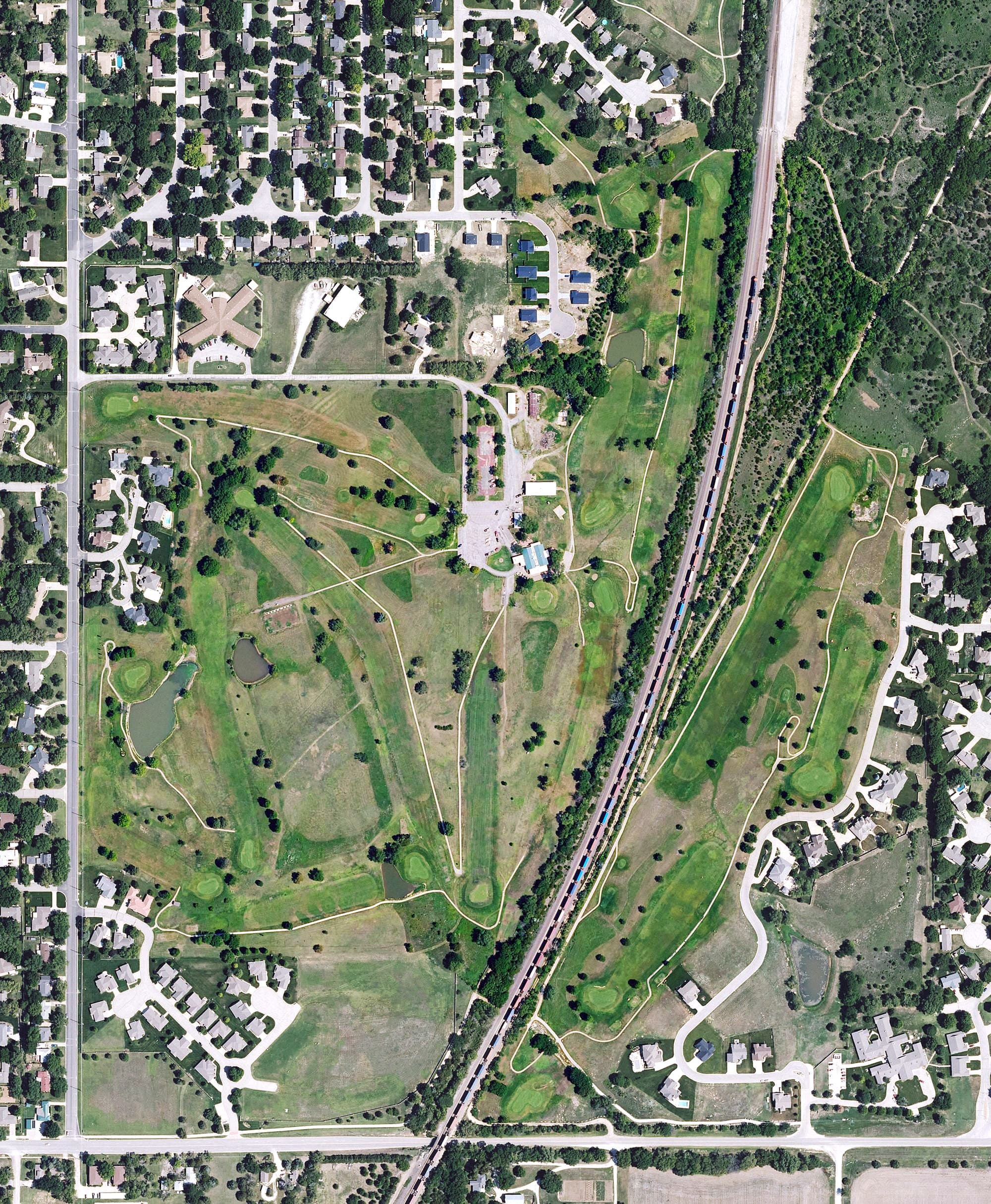 Aerial view of Prairie Trails Golf Course, KS, with its hole routing marked