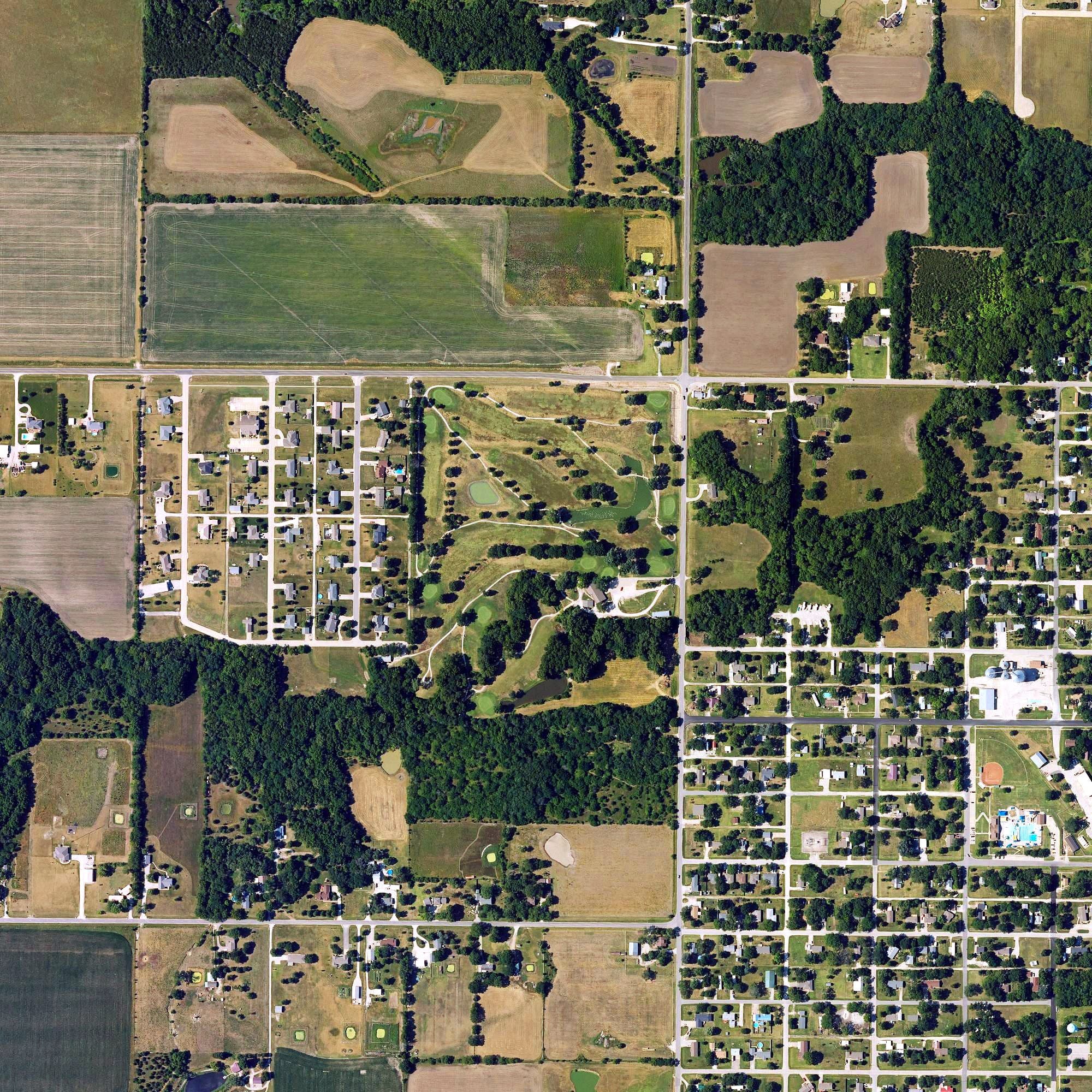 Aerial view of Rock Creek Country Club, KS, with its hole routing marked