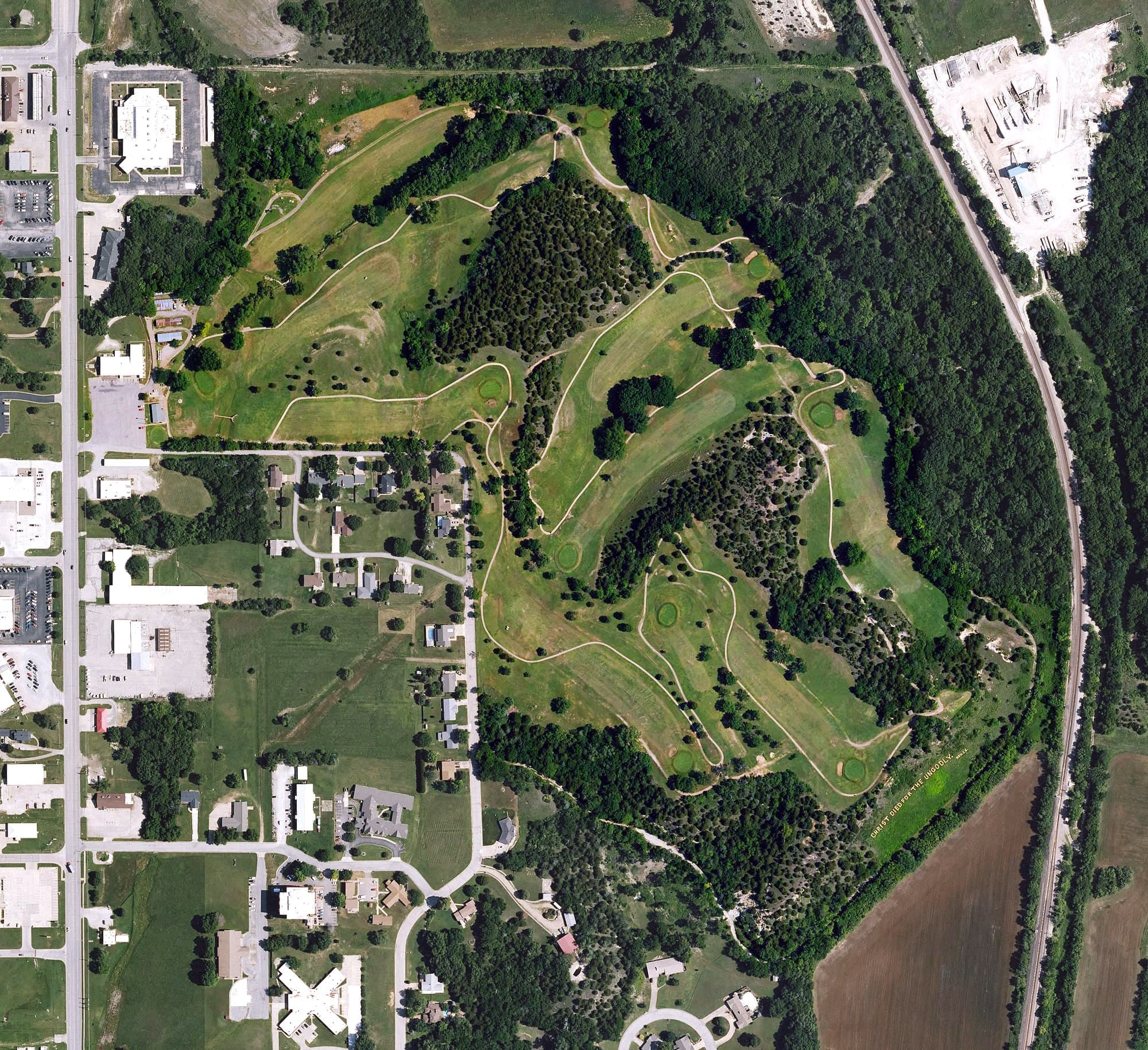 Aerial view of Spring Hill Golf Course, KS, with its hole routing marked