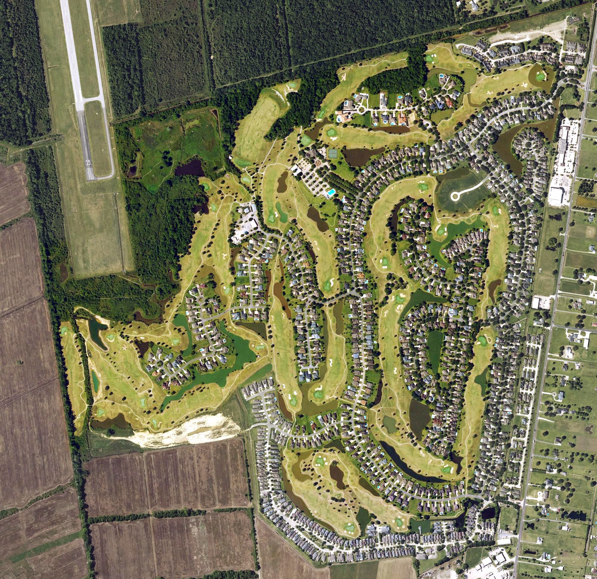 Aerial view of Pelican Point Golf and Country Club, LA, with its hole routing marked