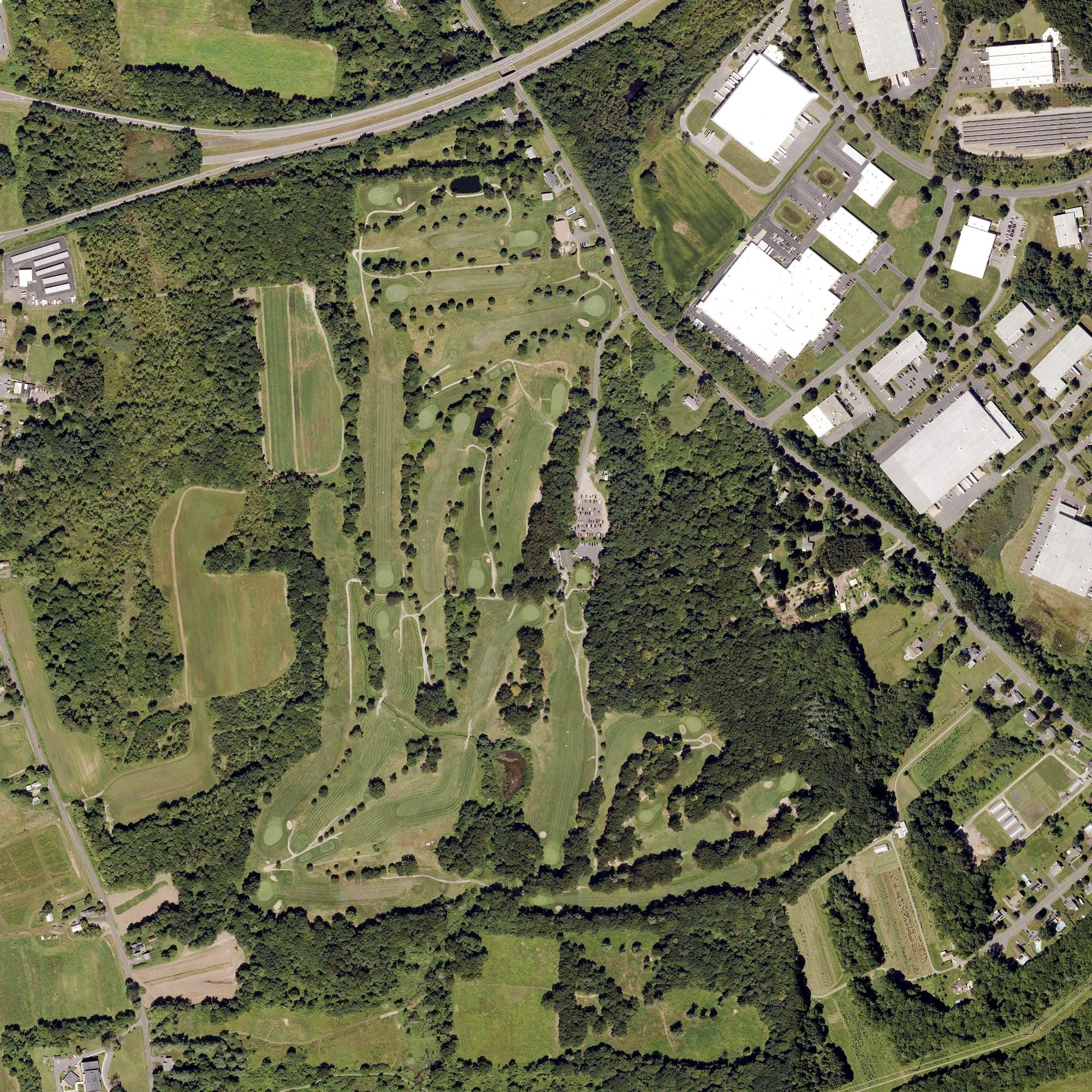 Aerial view of St. Anne Country Club, MA, with its hole routing marked