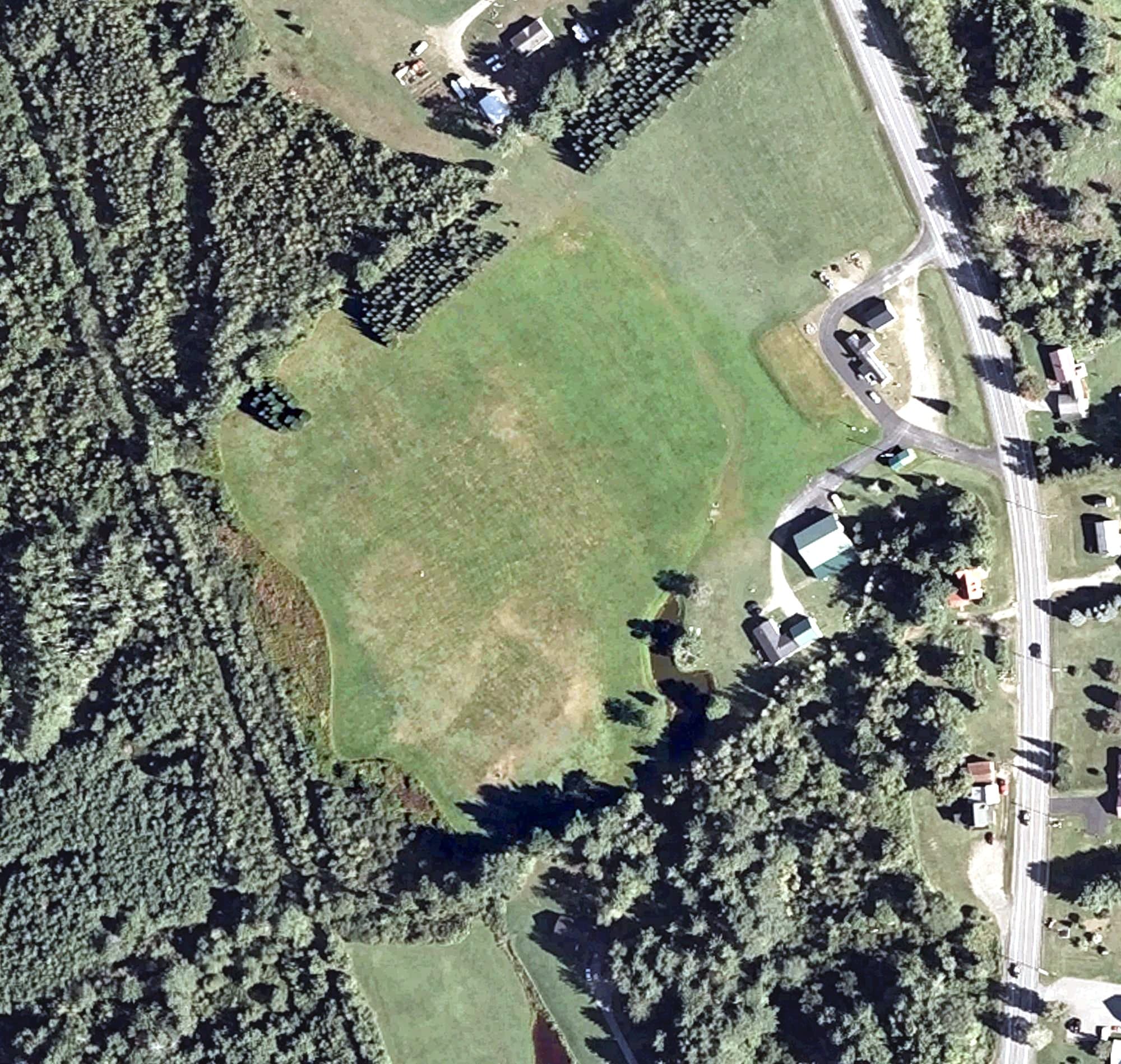 Aerial view of Loon's Cove Driving Range, ME, with its hole routing marked