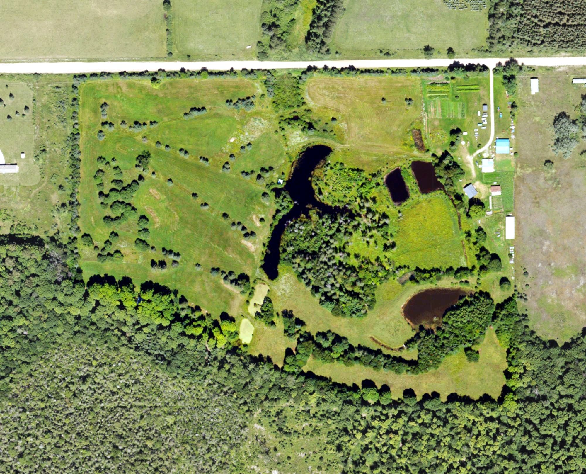 Aerial view of Blue Heron Golf Course, MI, with its hole routing marked
