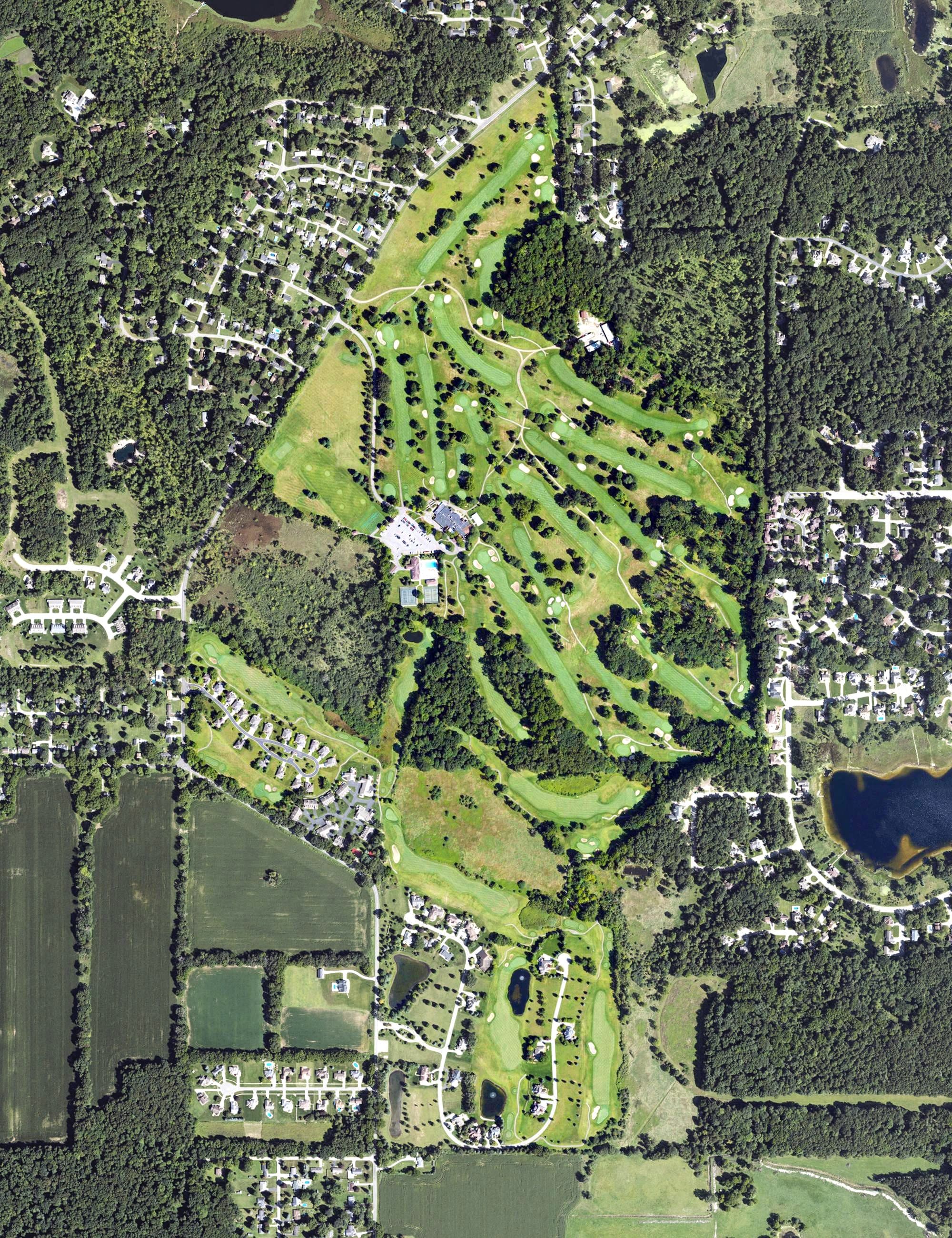 Aerial view of Country Club of Jackson, MI, with its hole routing marked