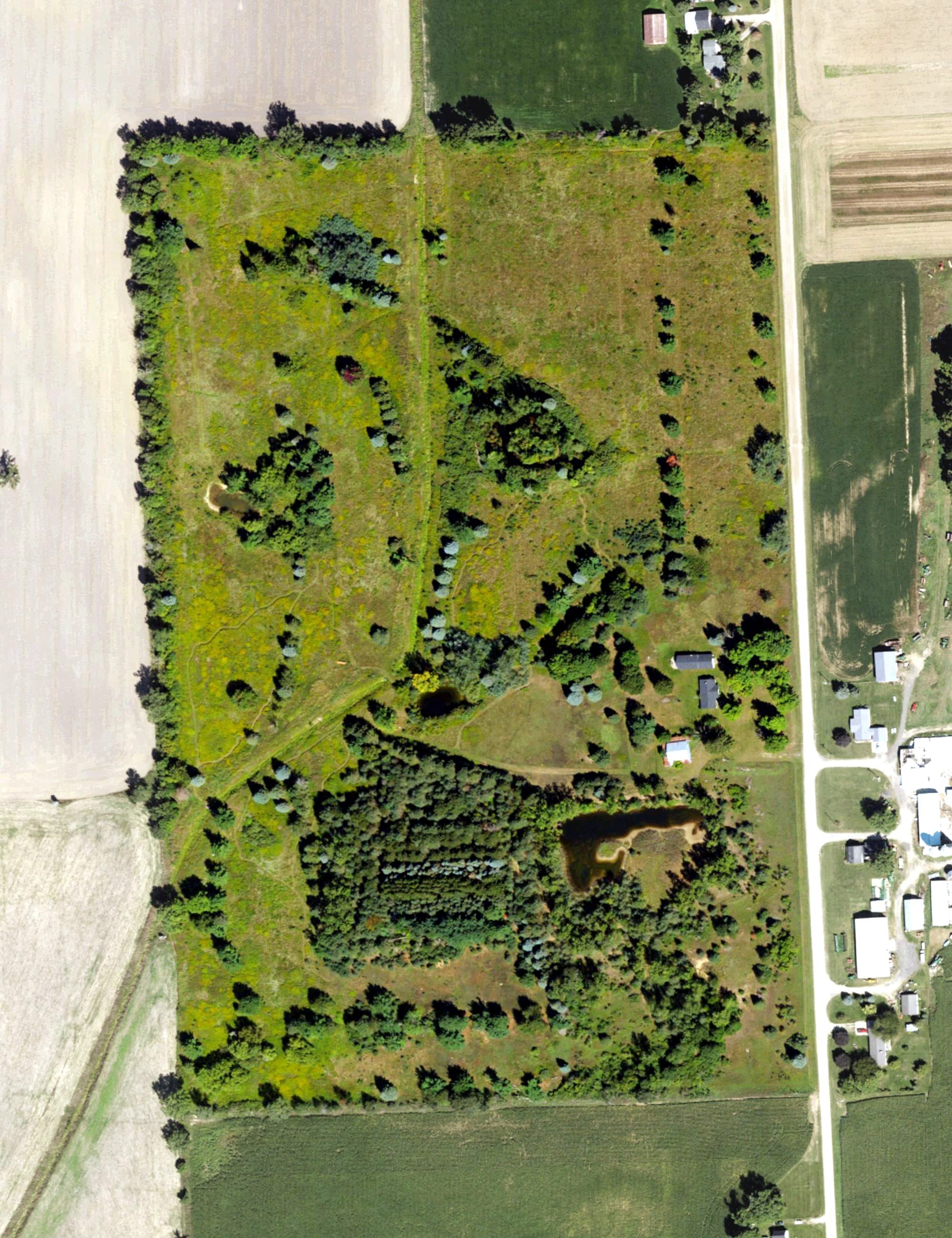 Aerial view of EMS Links Golf Course, MI, with its hole routing marked