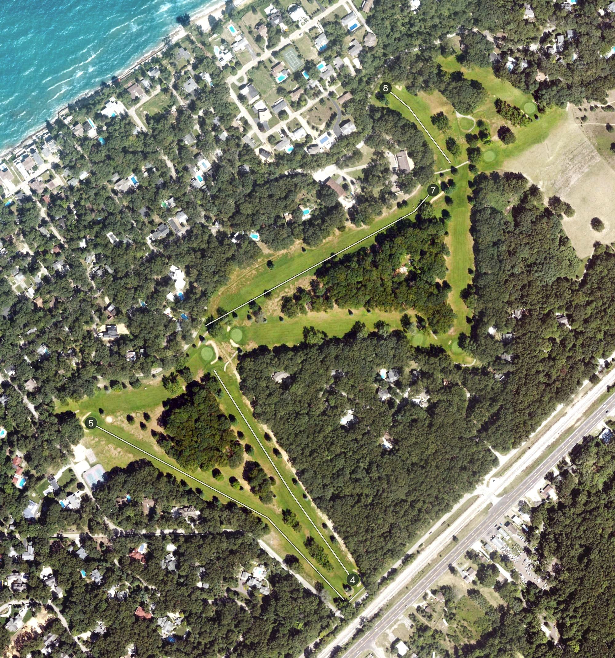 Aerial view of Grand Beach Golf Course, MI, with its hole routing marked