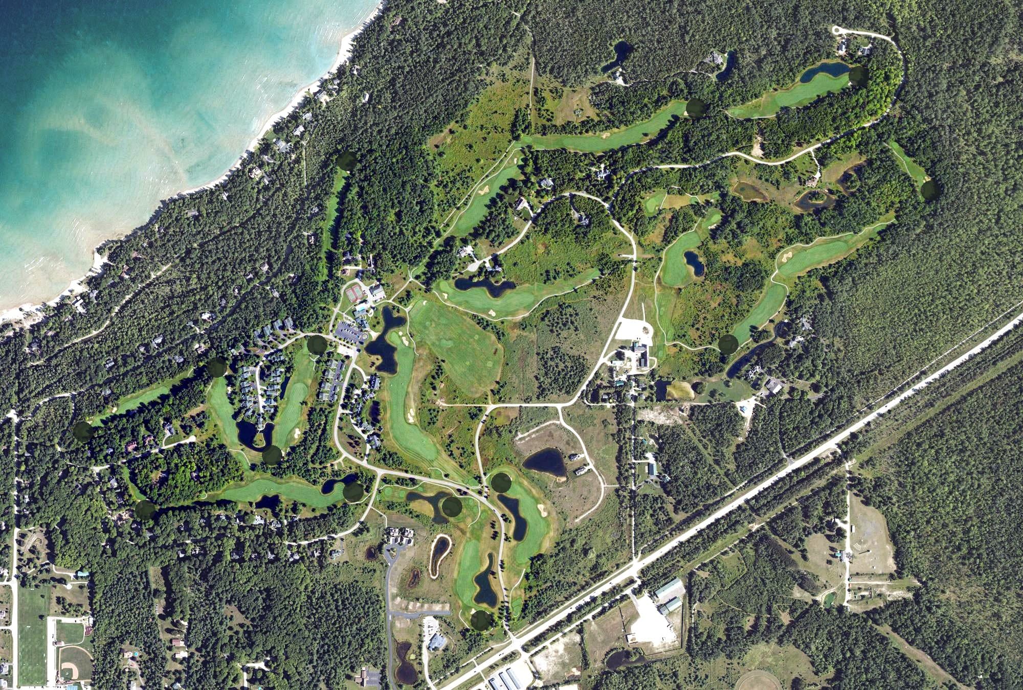 Aerial view of Heatherwoods Golf Course, MI, with its hole routing marked