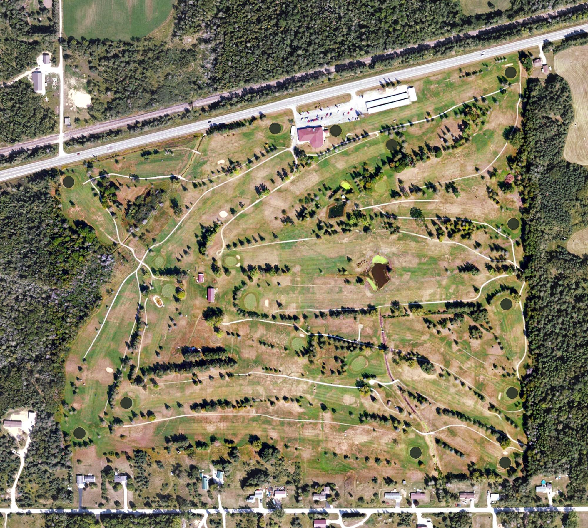 Aerial view of Highland Golf Club, MI, with its hole routing marked