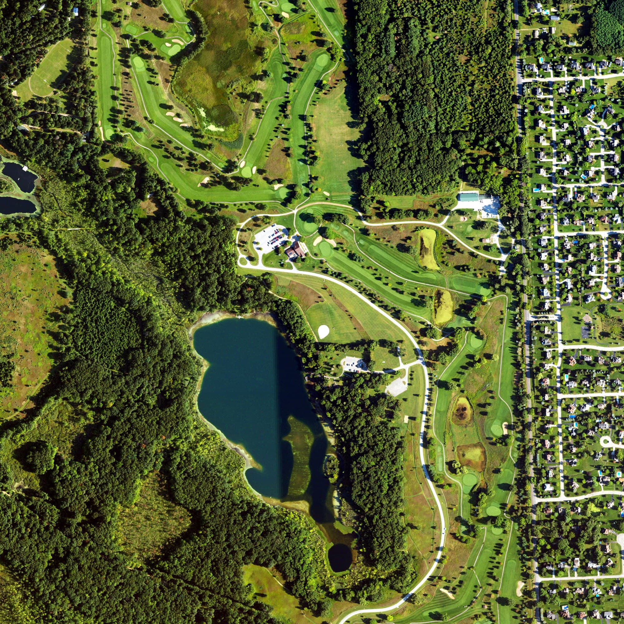 Aerial view of Huron Meadows Golf Course, MI, with its hole routing marked