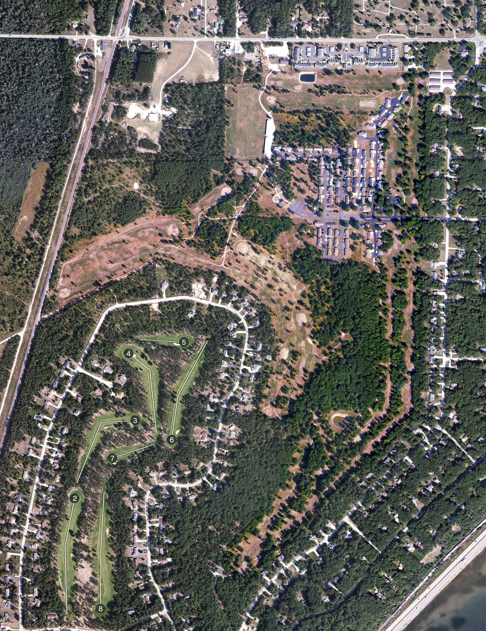 Aerial view of Irish Oaks Golf Course and Driving Range, MI, with its hole routing marked
