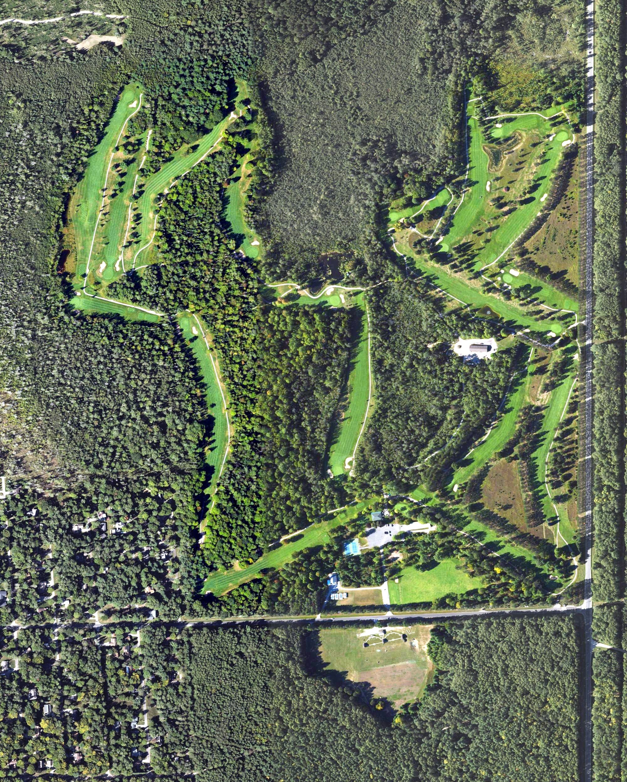 Aerial view of Lost Lake Woods Golf Course, MI, with its hole routing marked