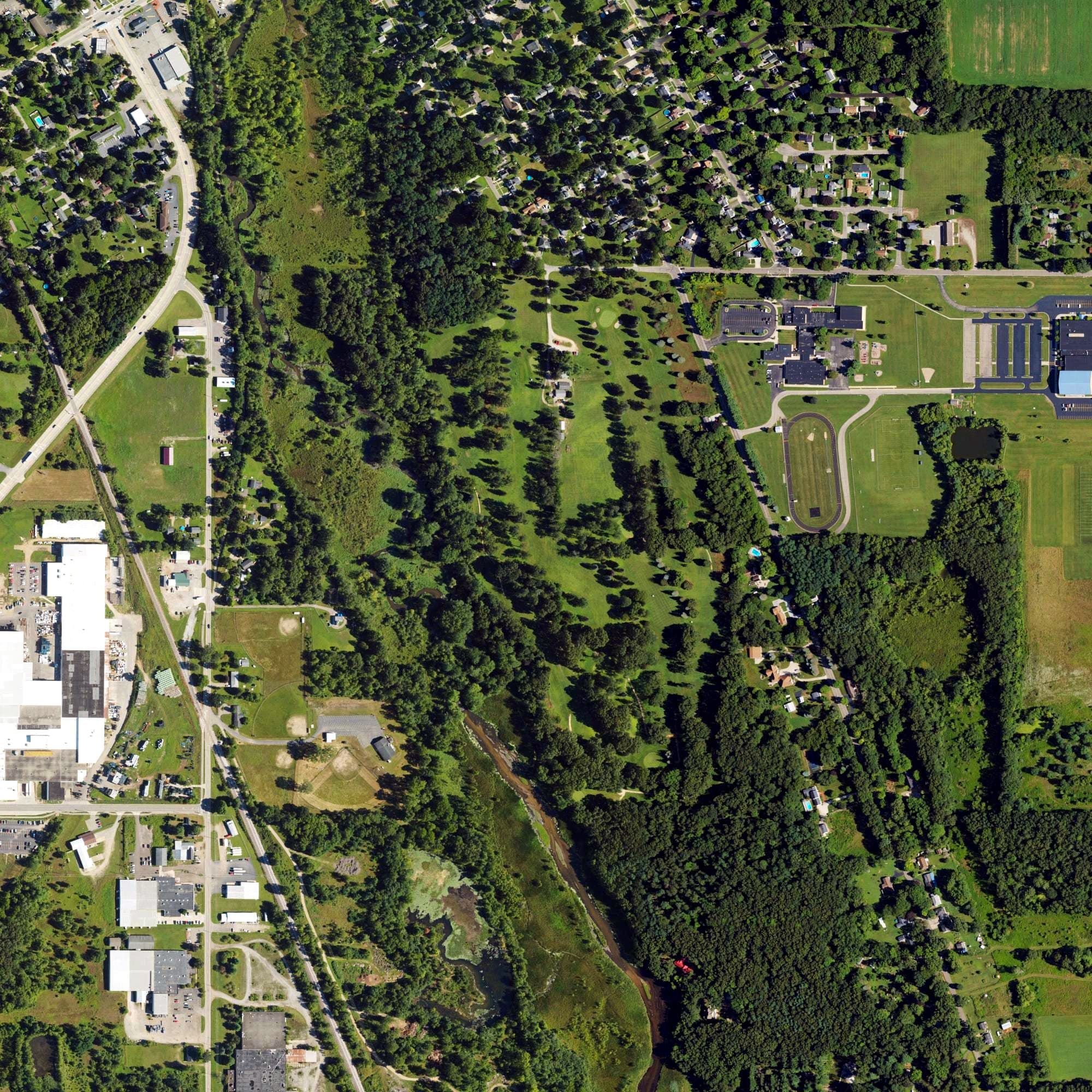 Aerial view of Mill Race Golf Course, MI, with its hole routing marked