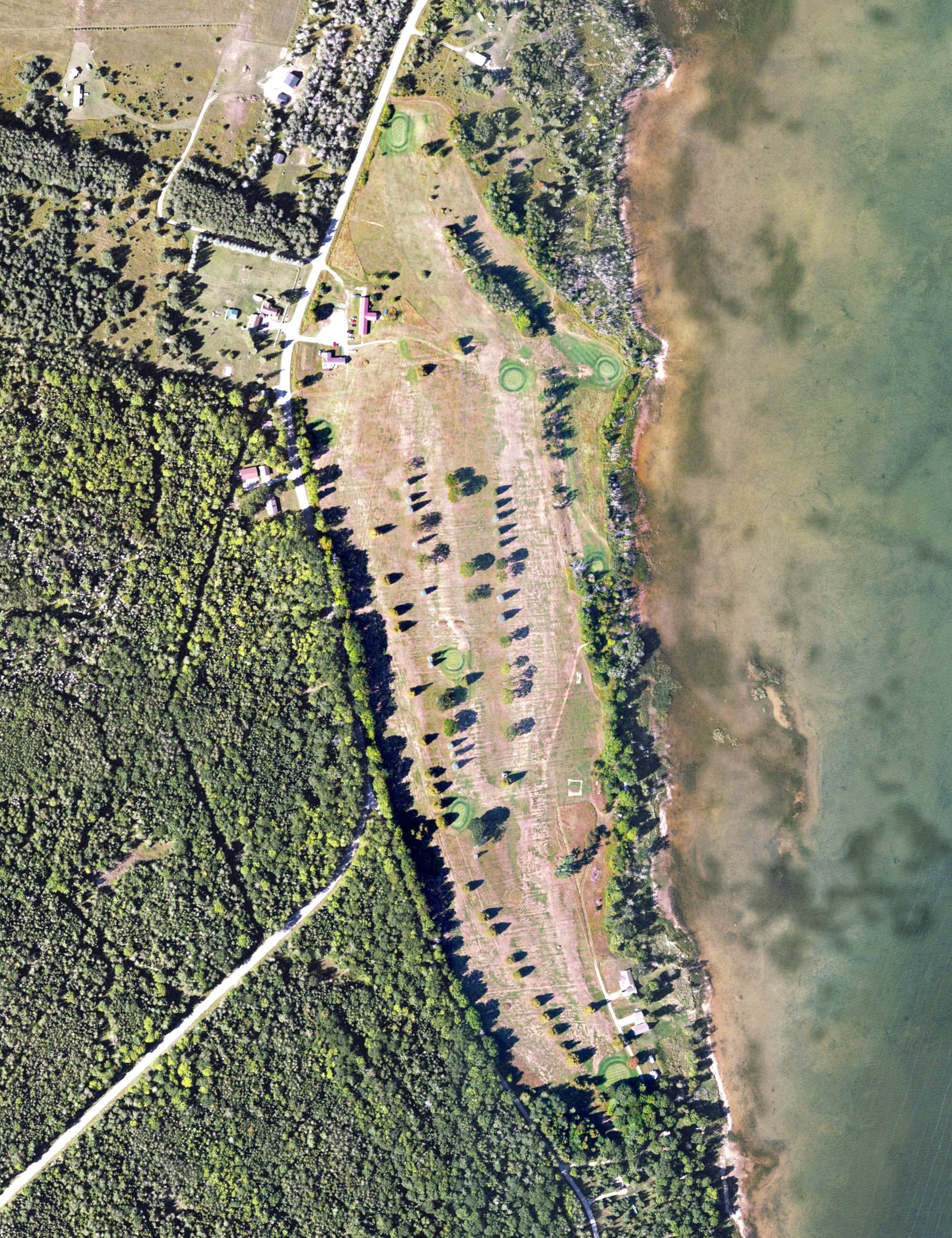 Aerial view of Nahma Golf Course, MI, with its hole routing marked