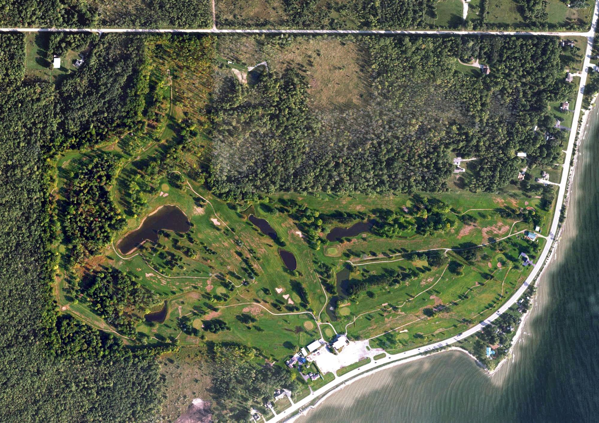 Aerial view of North Shore Golf Club, MI, with its hole routing marked