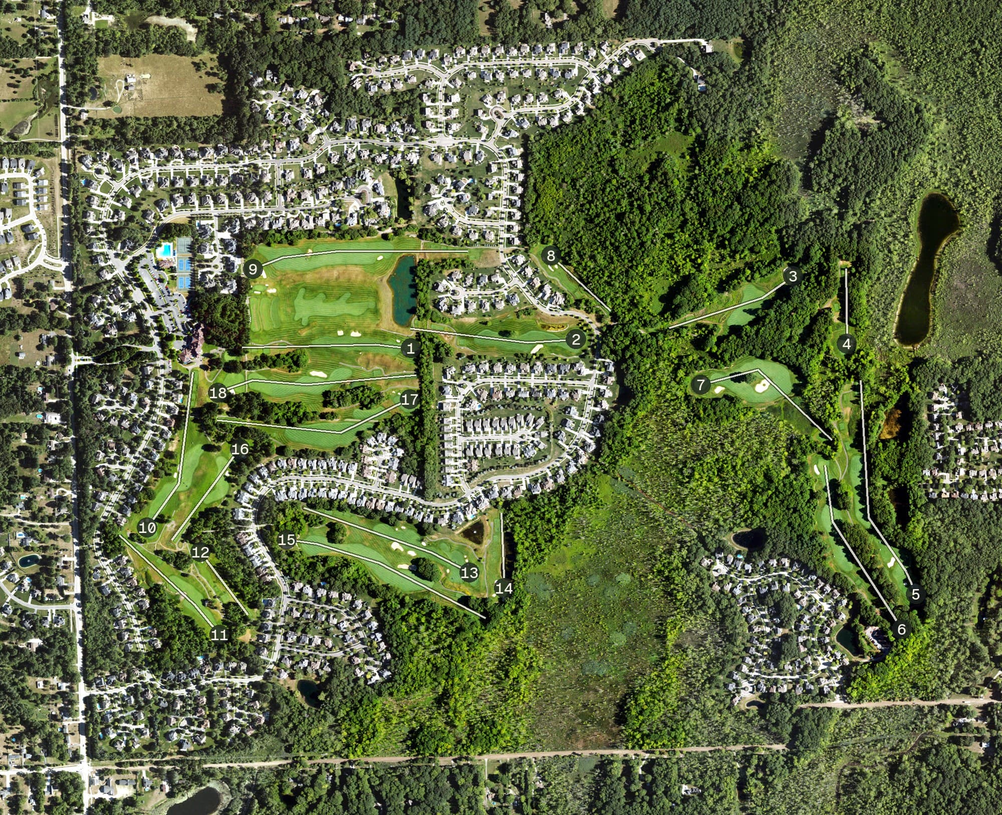 Aerial view of Oakhurst Golf & Country Club, MI, with its hole routing marked
