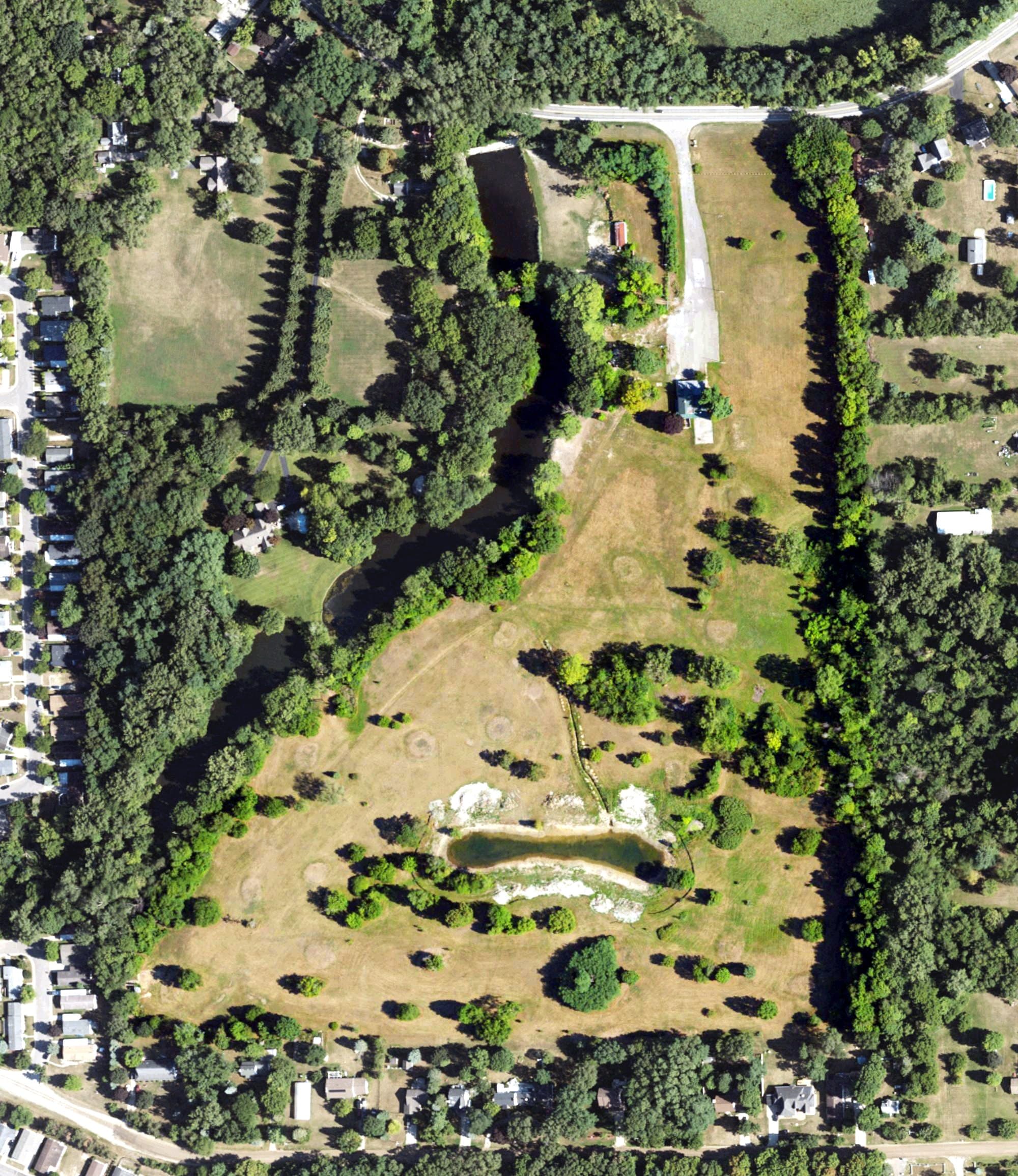 Aerial view of Pine Creek Golf Course, MI, with its hole routing marked