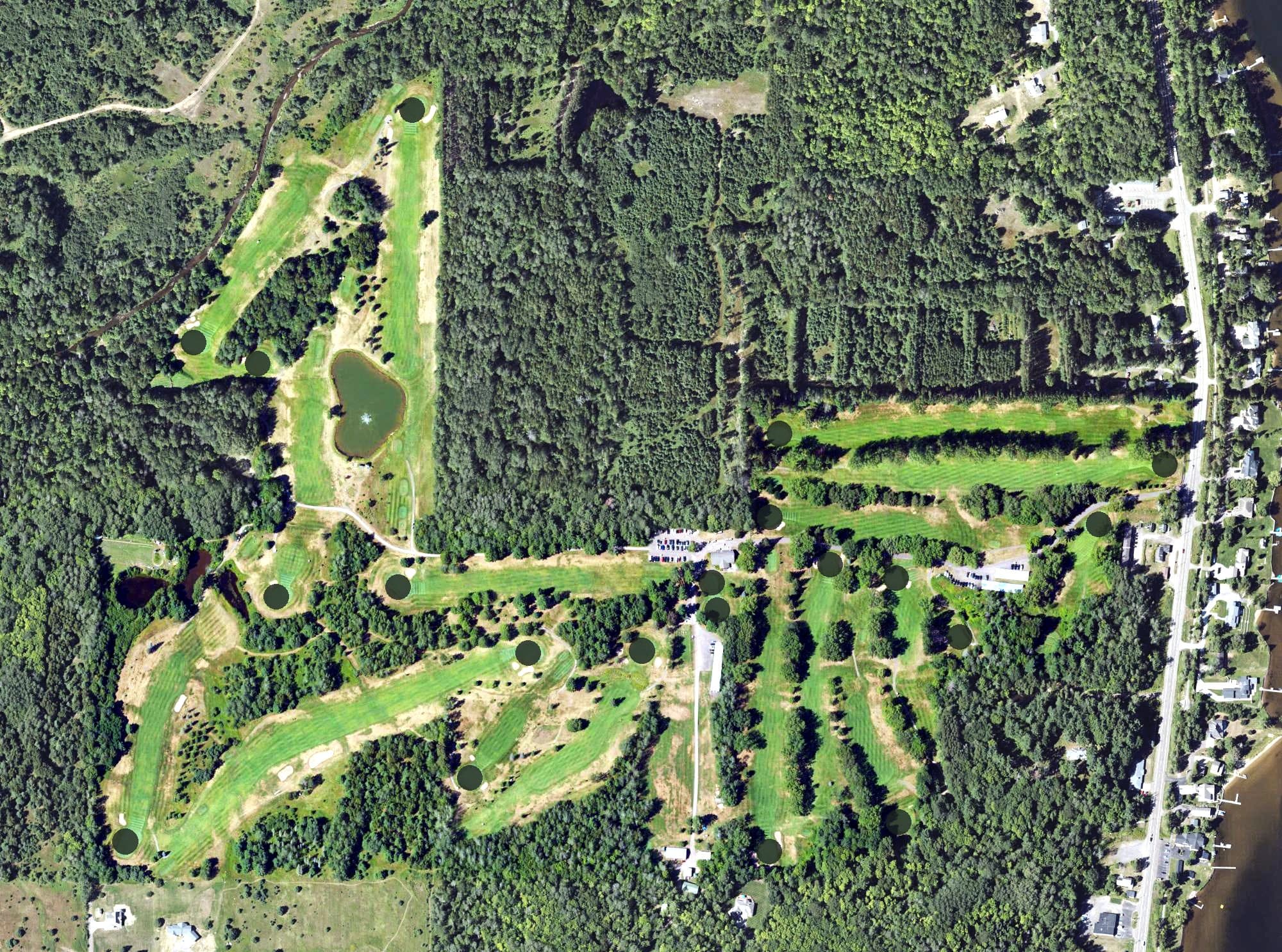 Aerial view of Portage Lake Golf Course, MI, with its hole routing marked