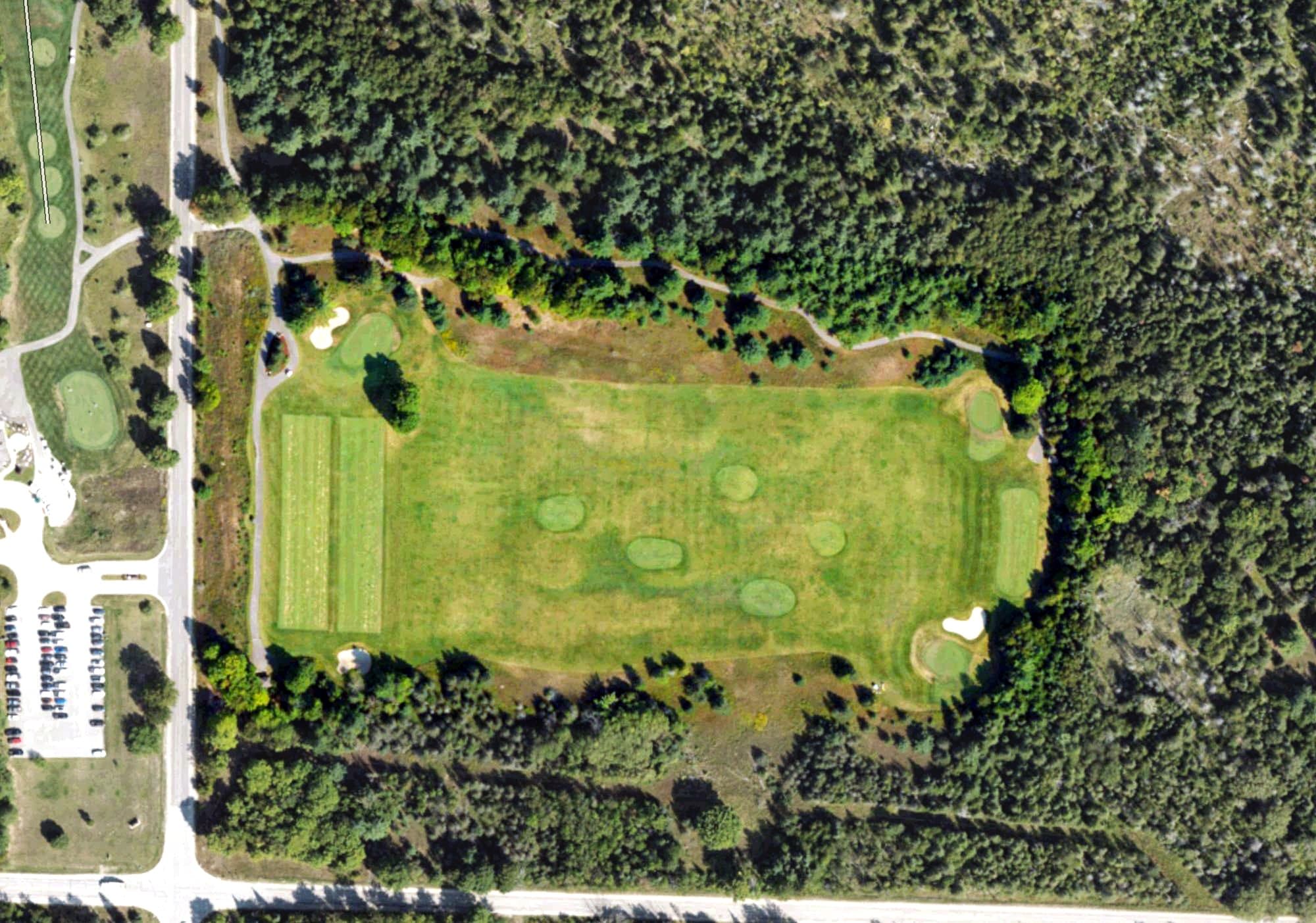 Aerial view of Practice Area, MI, with its hole routing marked