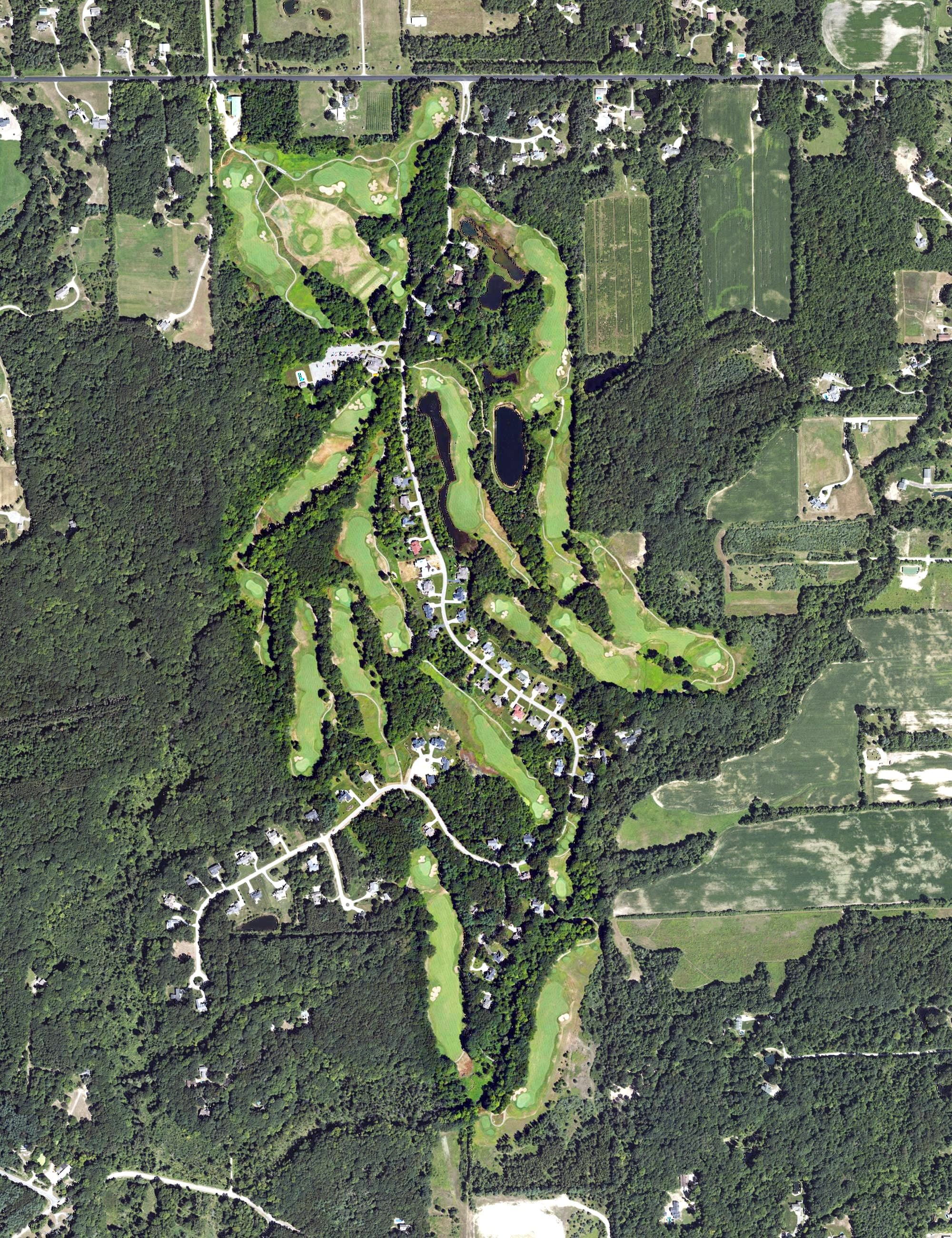 Aerial view of Ravines Golf Club, MI, with its hole routing marked