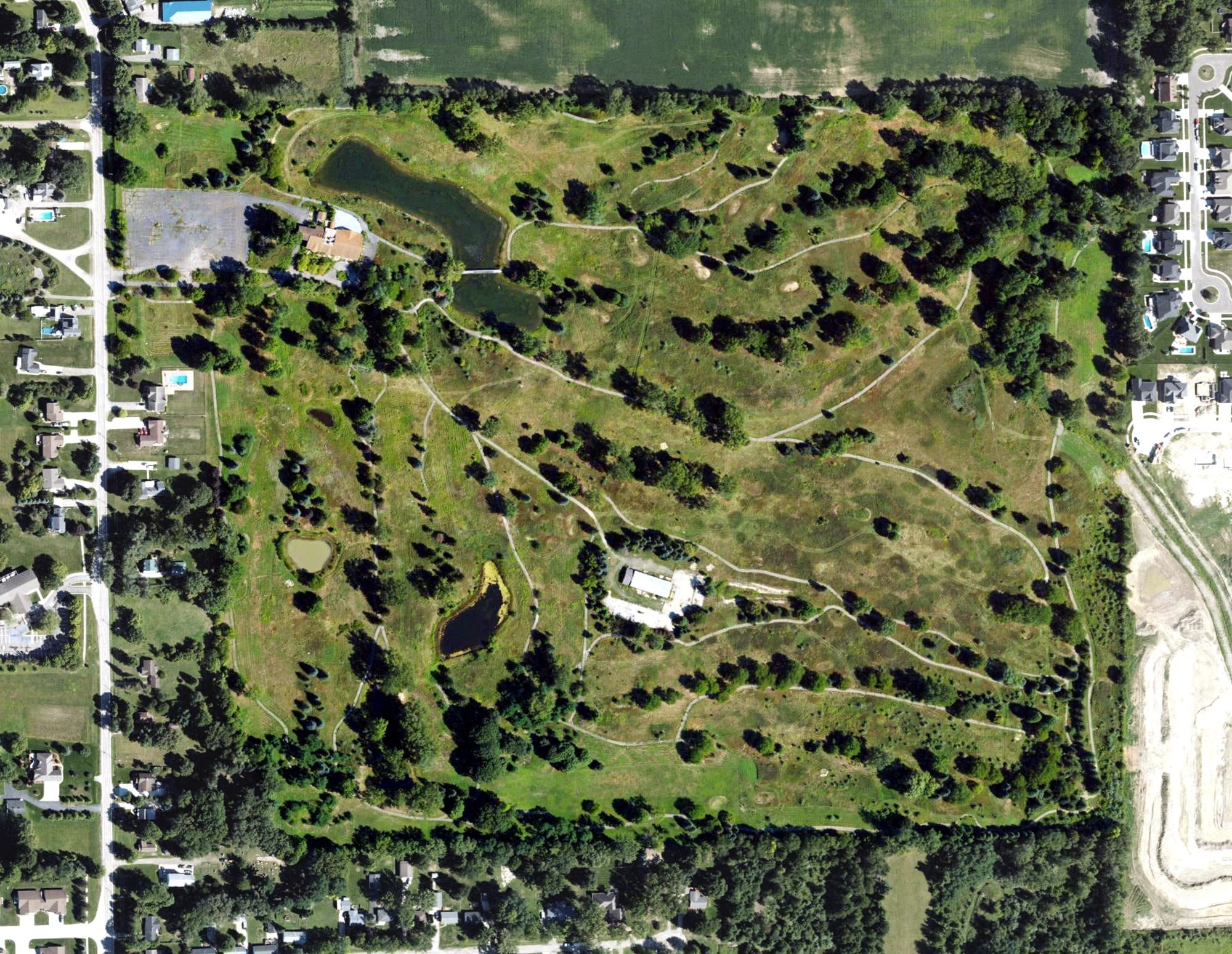 Aerial view of Scalawags Golf Club, MI, with its hole routing marked