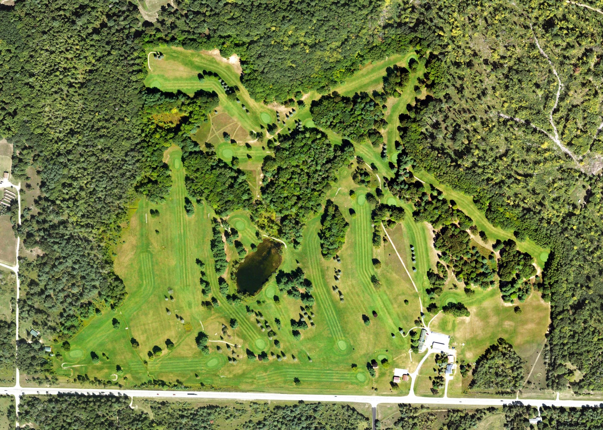 Aerial view of Spring Valley Golf Course, MI, with its hole routing marked