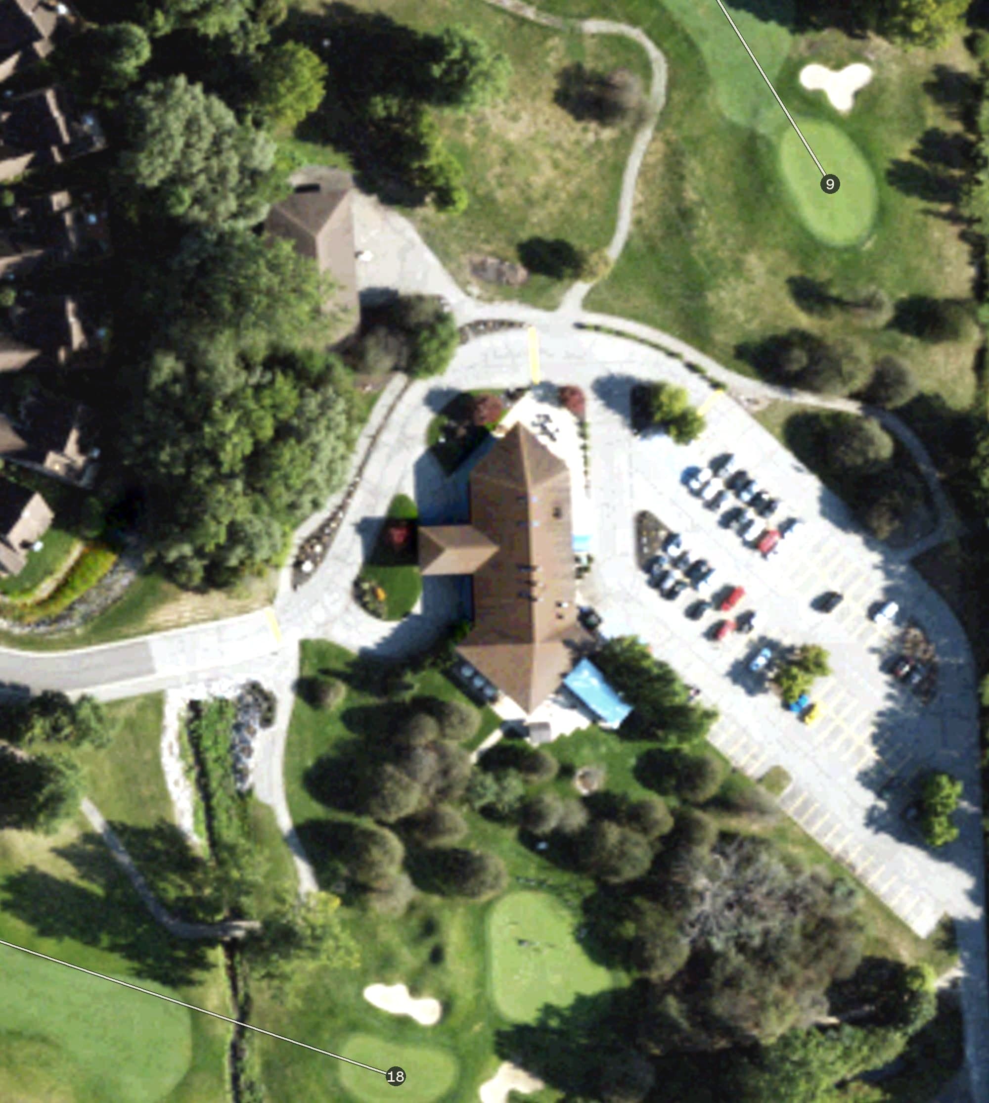 Aerial view of Stonebridge Golf Club, MI, with its hole routing marked