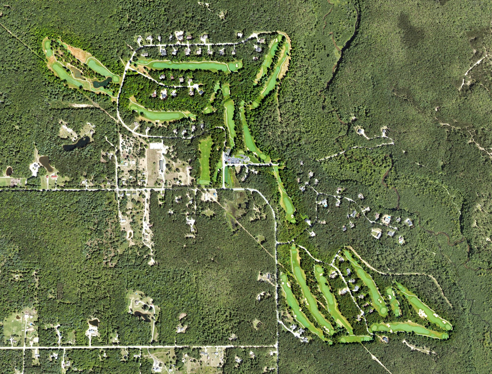 Aerial view of Stonegate Golf Club, MI, with its hole routing marked