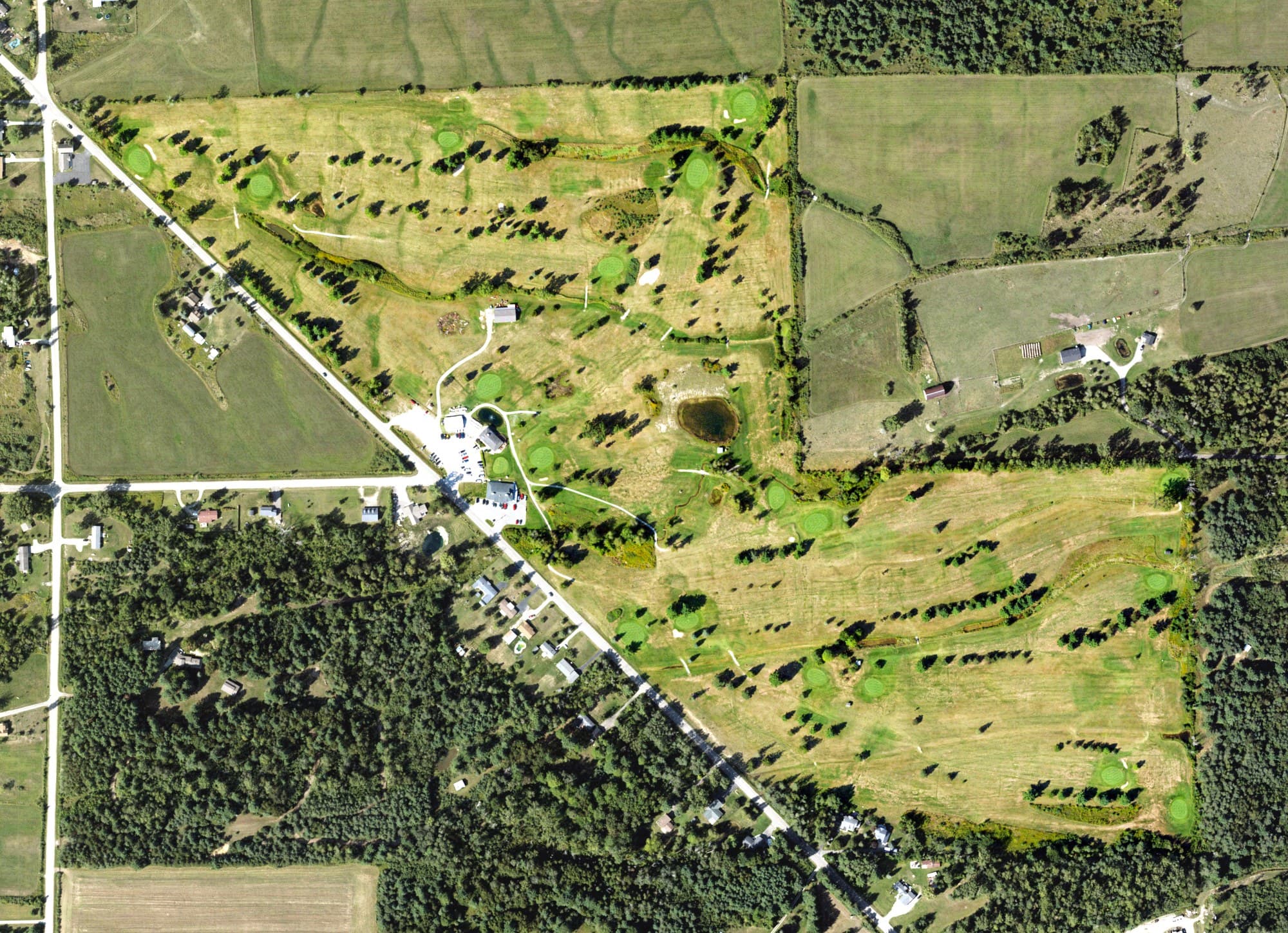 Aerial view of Tawas Creek Golf Club, MI, with its hole routing marked