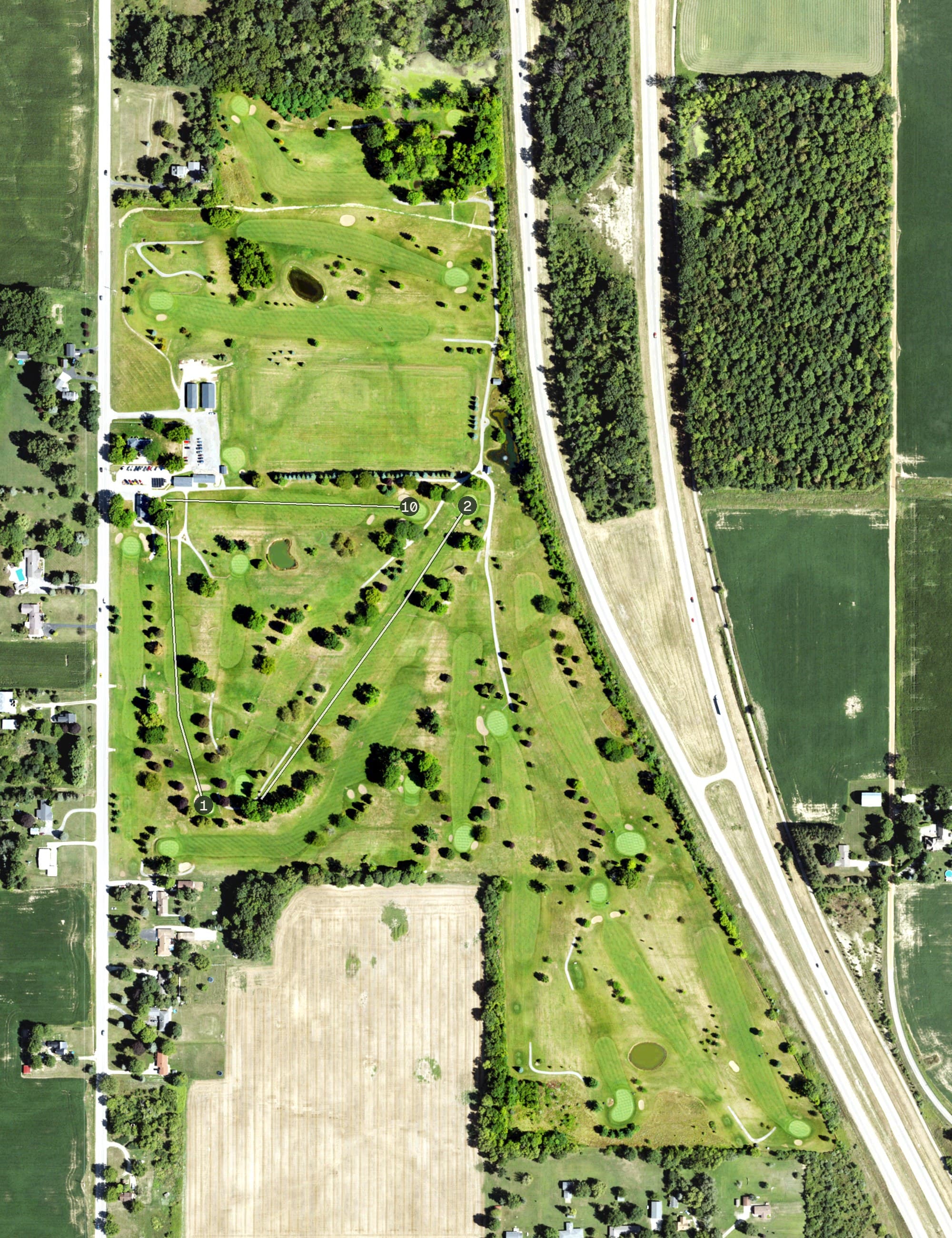 Aerial view of The Fields Golf Course, MI, with its hole routing marked
