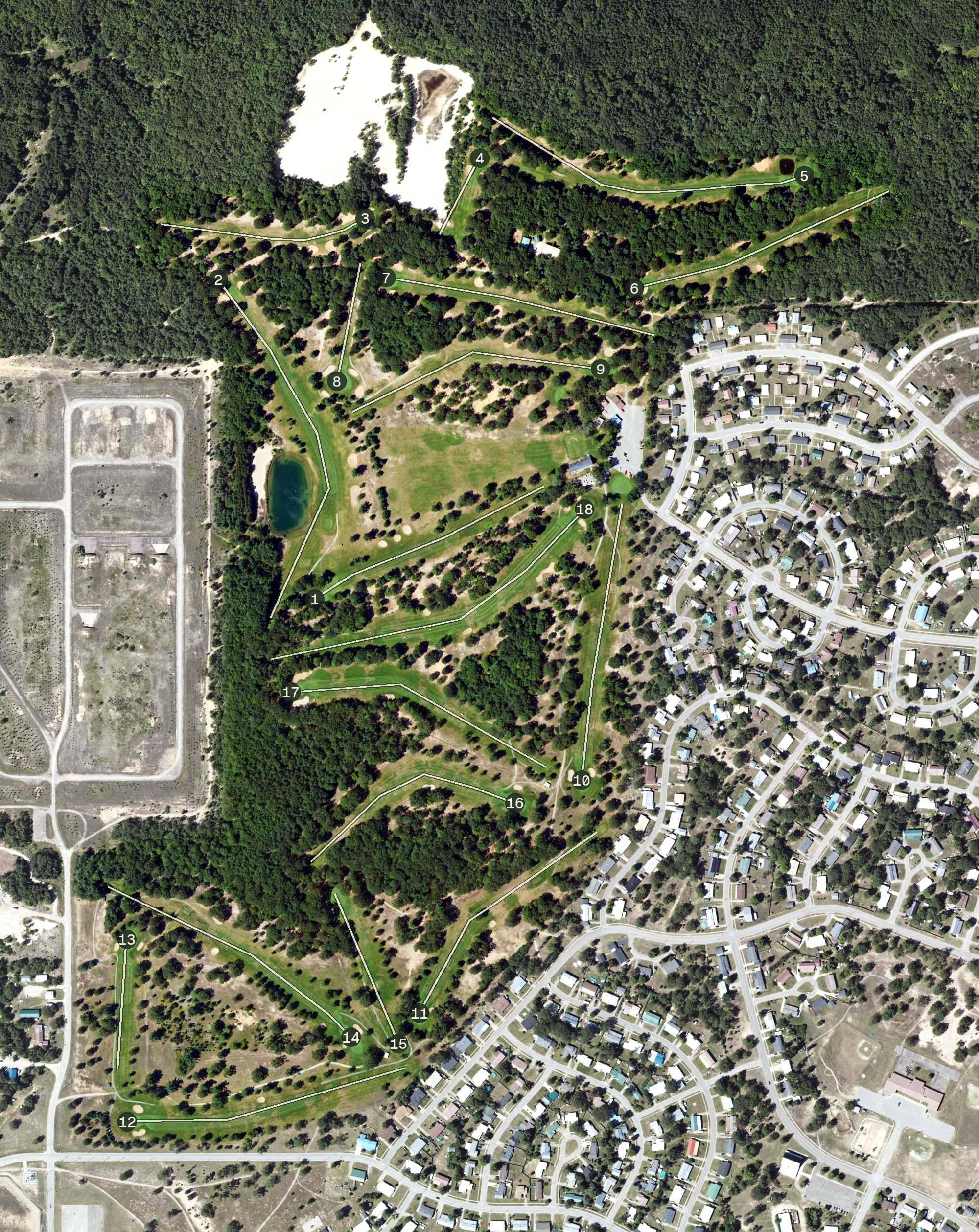 Aerial view of The Oaks at Kincheloe, MI, with its hole routing marked