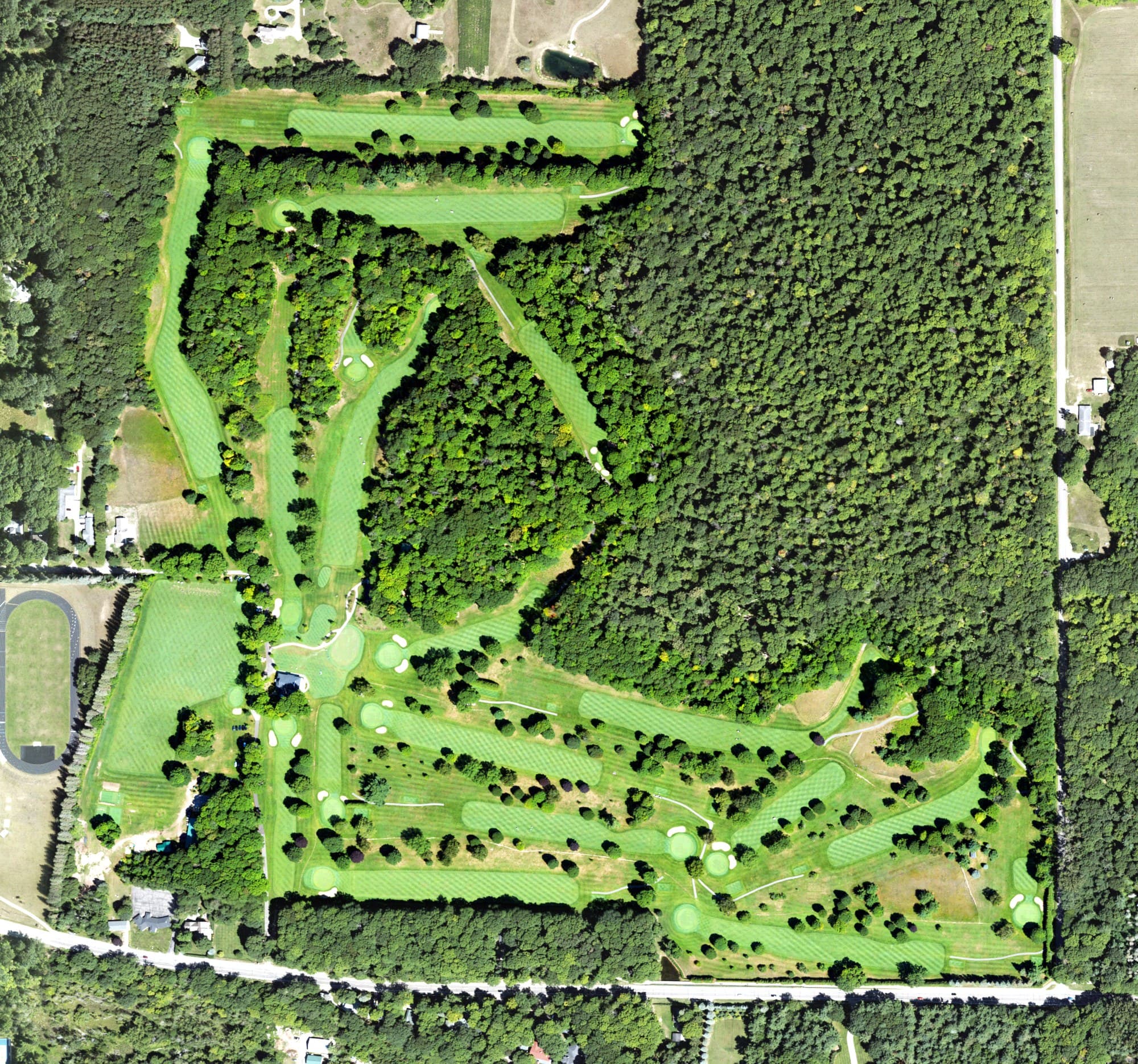 Aerial view of Wequetonsing Golf Club, MI, with its hole routing marked