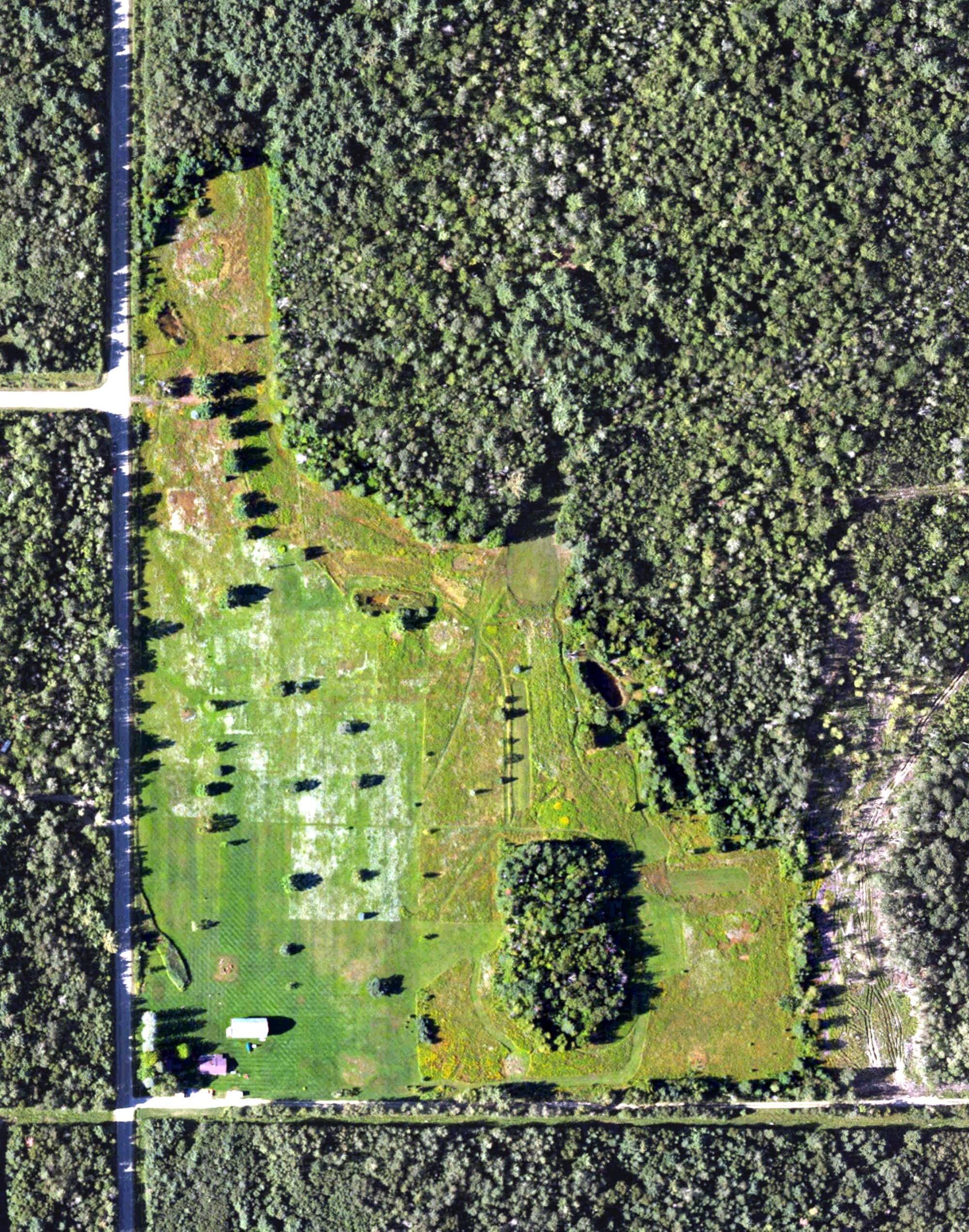 Aerial view of Wilderness Golf Course, MI, with its hole routing marked