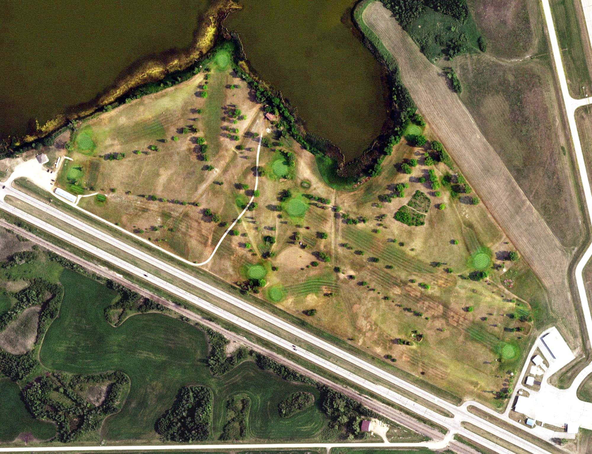 Aerial view of Fosston Golf Club, MN, with its hole routing marked