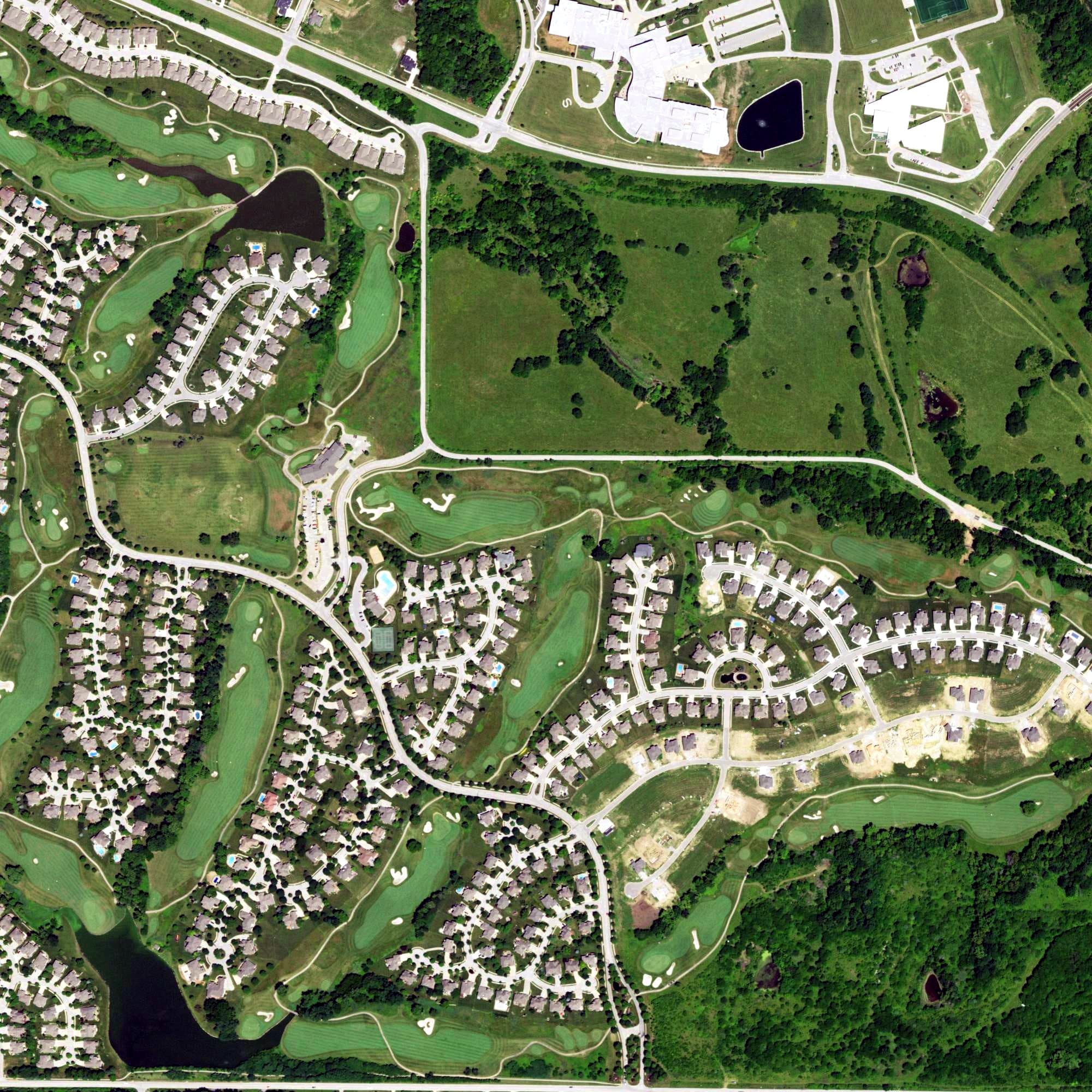 Aerial view of Staley Farms Golf Club, MO, with its hole routing marked
