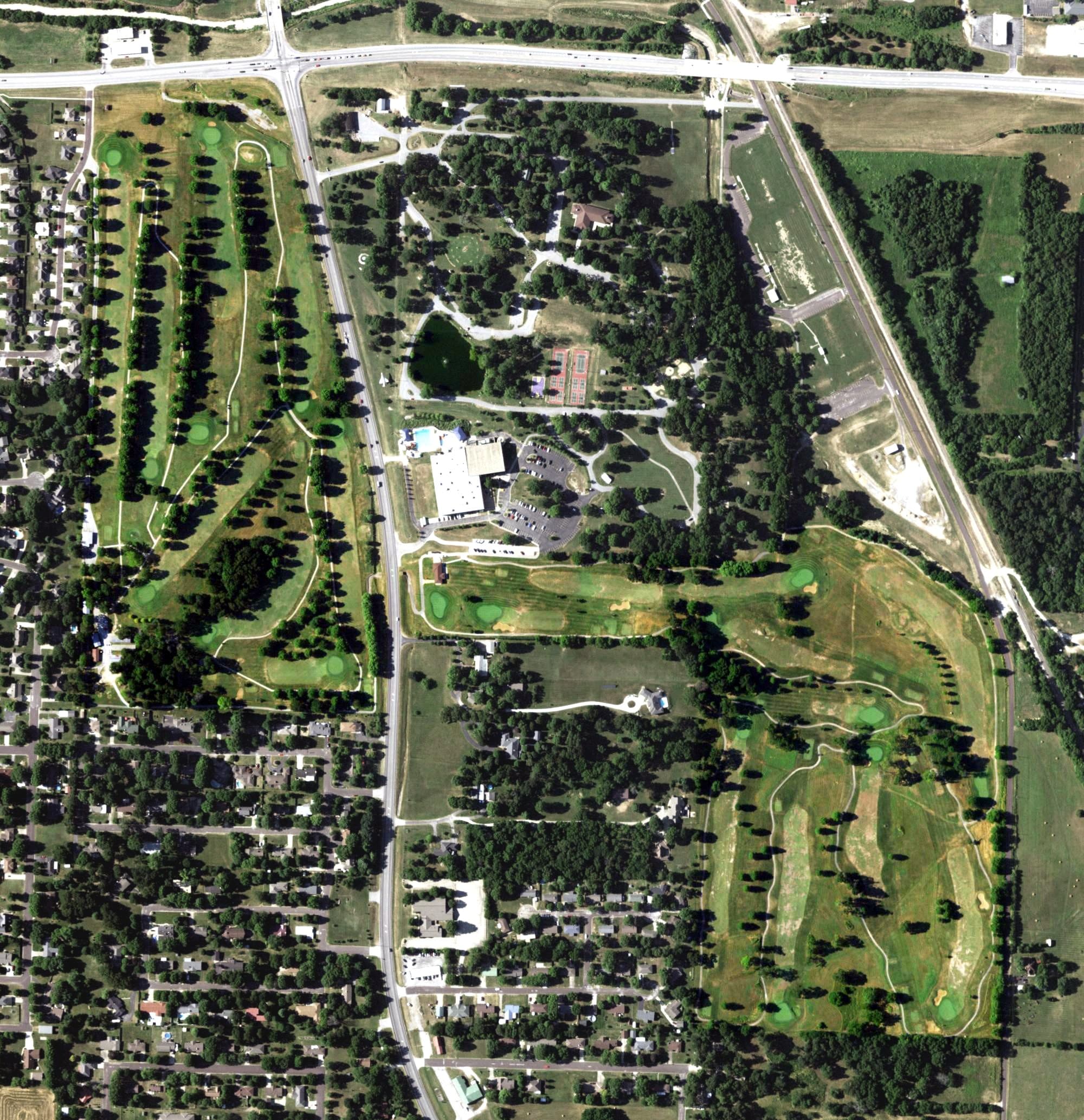 Aerial view of Windmill Ridge Golf Course, MO, with its hole routing marked