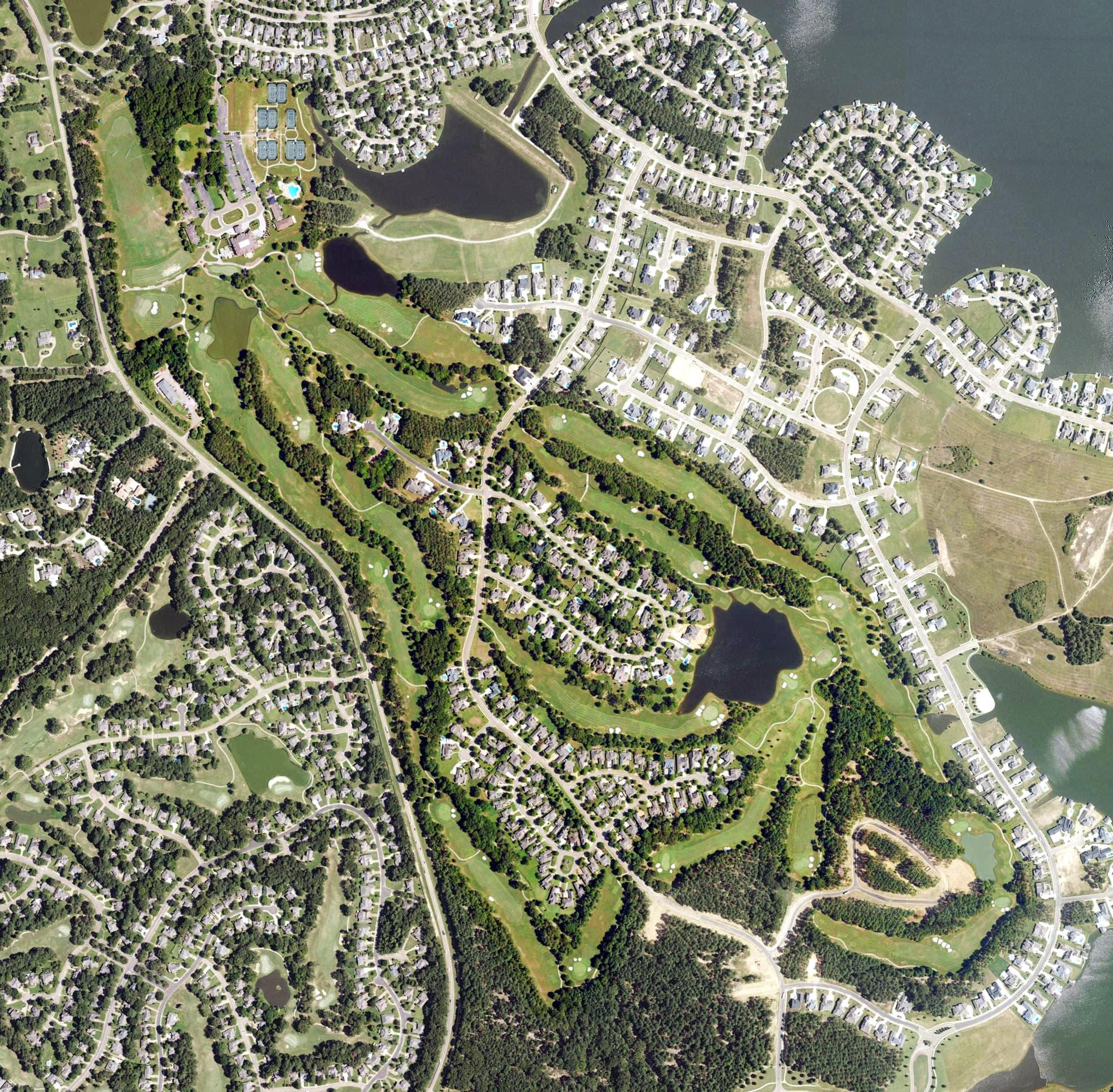 Aerial view of Reunion Golf and Country Club, MS, with its hole routing marked